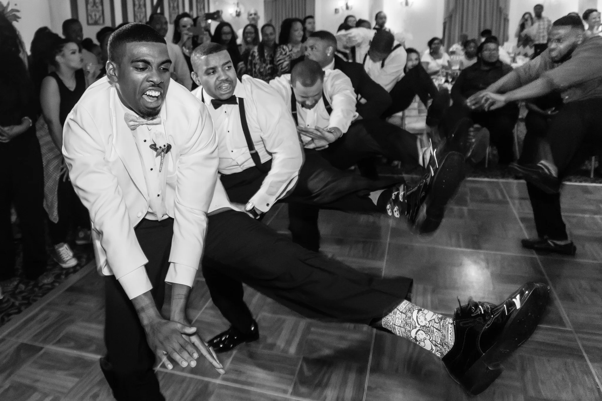 Groom Dancing with groomsmen at Mediterranean Village