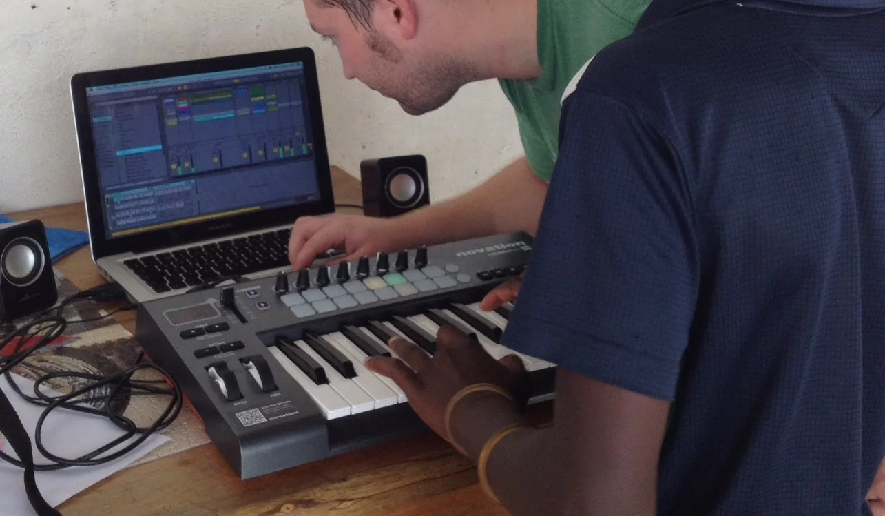 Me showing a boy how to make beats