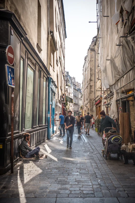 The Jewish District spreads across parts of the 3rd and 4th arrondissements in Paris on the right bank of the Seine. We were staying in Le Marais, very close by, in the 4th arrondissement, the trendiest shopping district in Paris. So much happening here in this photo. It’s one of my favorites.