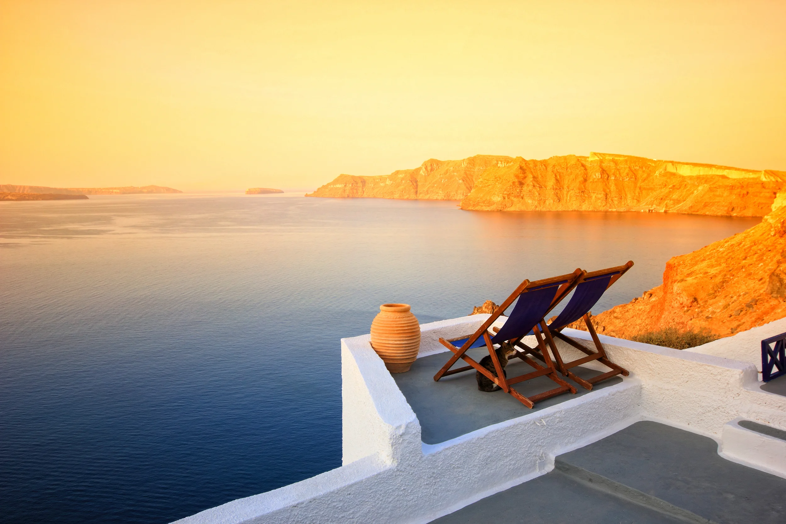 bigstock-Balcony-sunset-over-Santorini--32998985.jpg