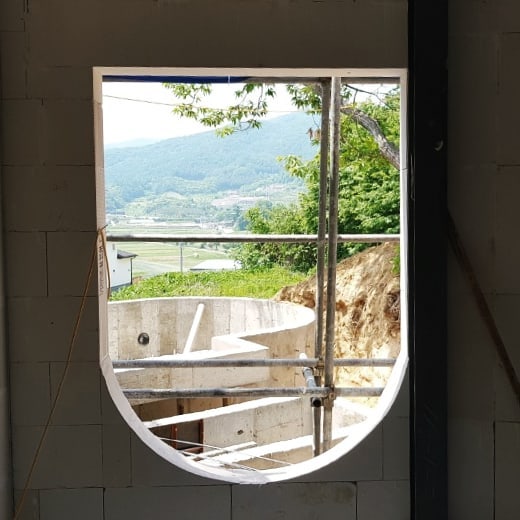 One arched view out from the #Vaulthouse. The window sill will be made into sitting for some gazing-out time. #arches #vaulthouse by #atelierchang #housedesign #architecture #architecturephotography #architecturehunter #construction