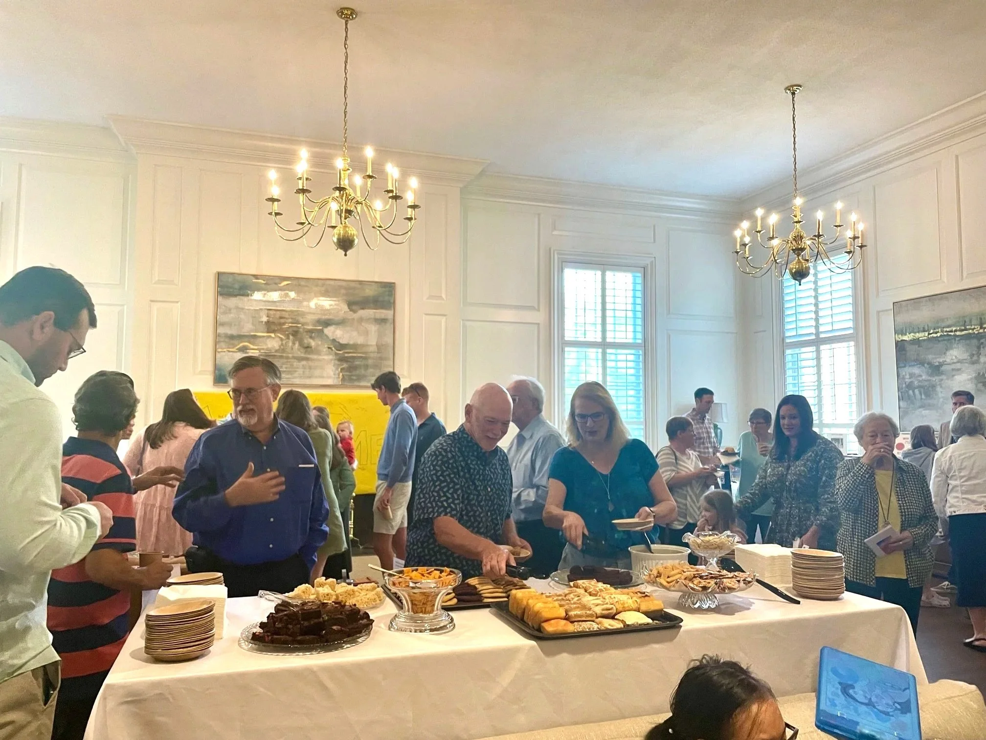 Caleb Meet and great after worship - food table.jpg