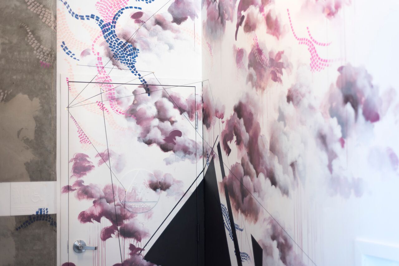 mural in hallway to the bathroom