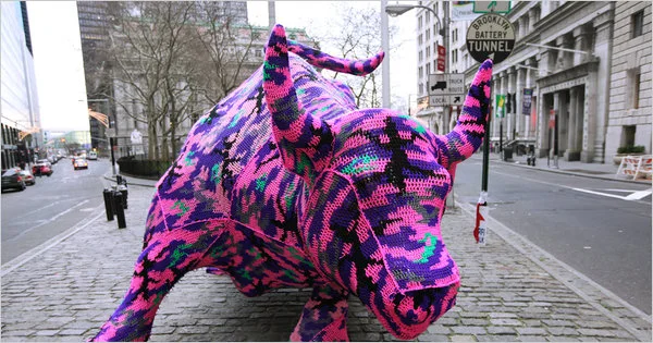 Crochet artist Olek covers a bull near Wall Street in New York City. Photo: New York Times.