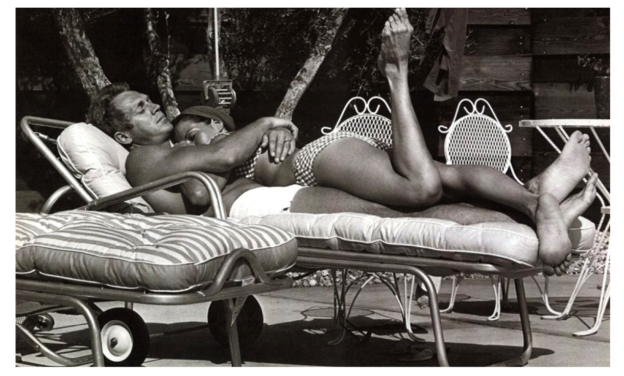 Steve McQueen cuddles with his wife, Ali McGraw in the mid '70s