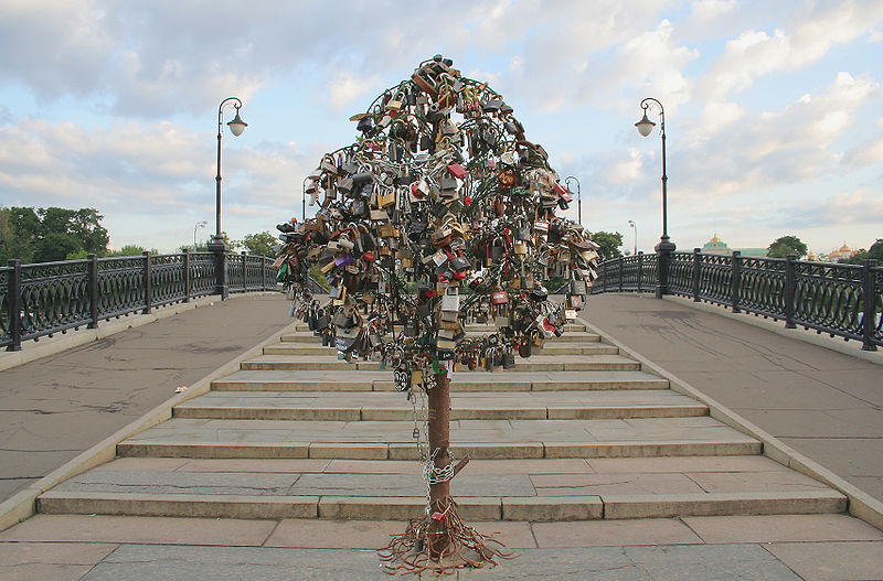 A purpose-built iron tree on a bridge across the Vodootvodny Canal in Moscow completely covered in love padlocks.