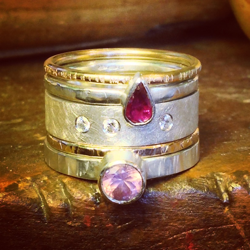 Silver and gold stacking rings set with a pear shaped vintage ruby, pink fair trade spinel and cubic zirconium.