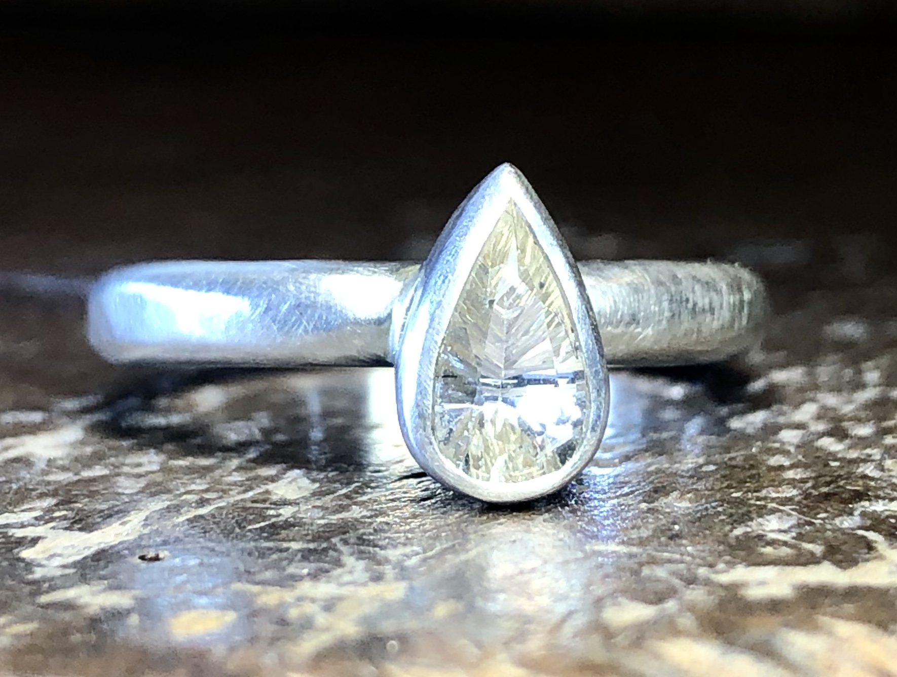 Recycled silver and concave cut white sapphire