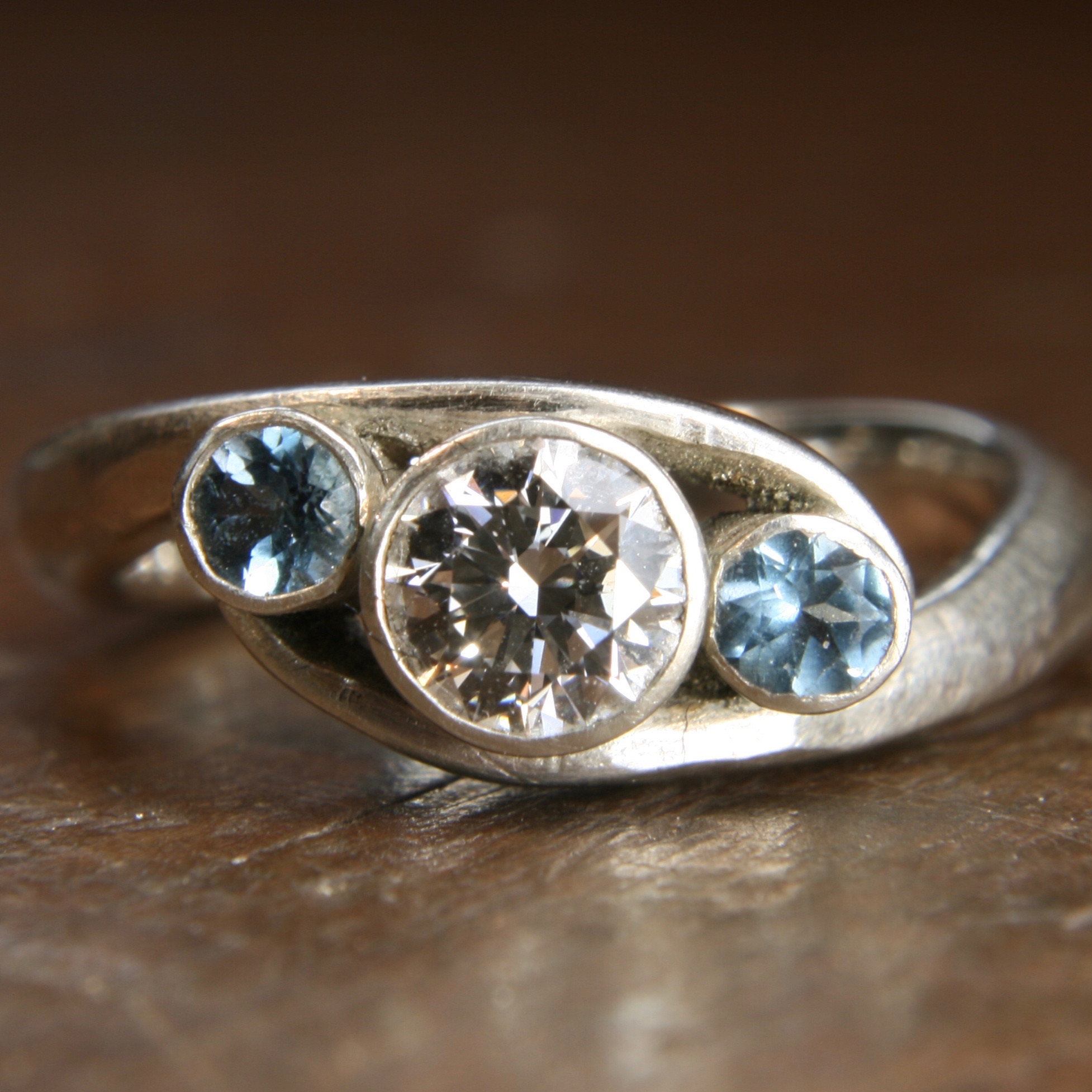 Bespoke moissanite and aquamarine twist ring