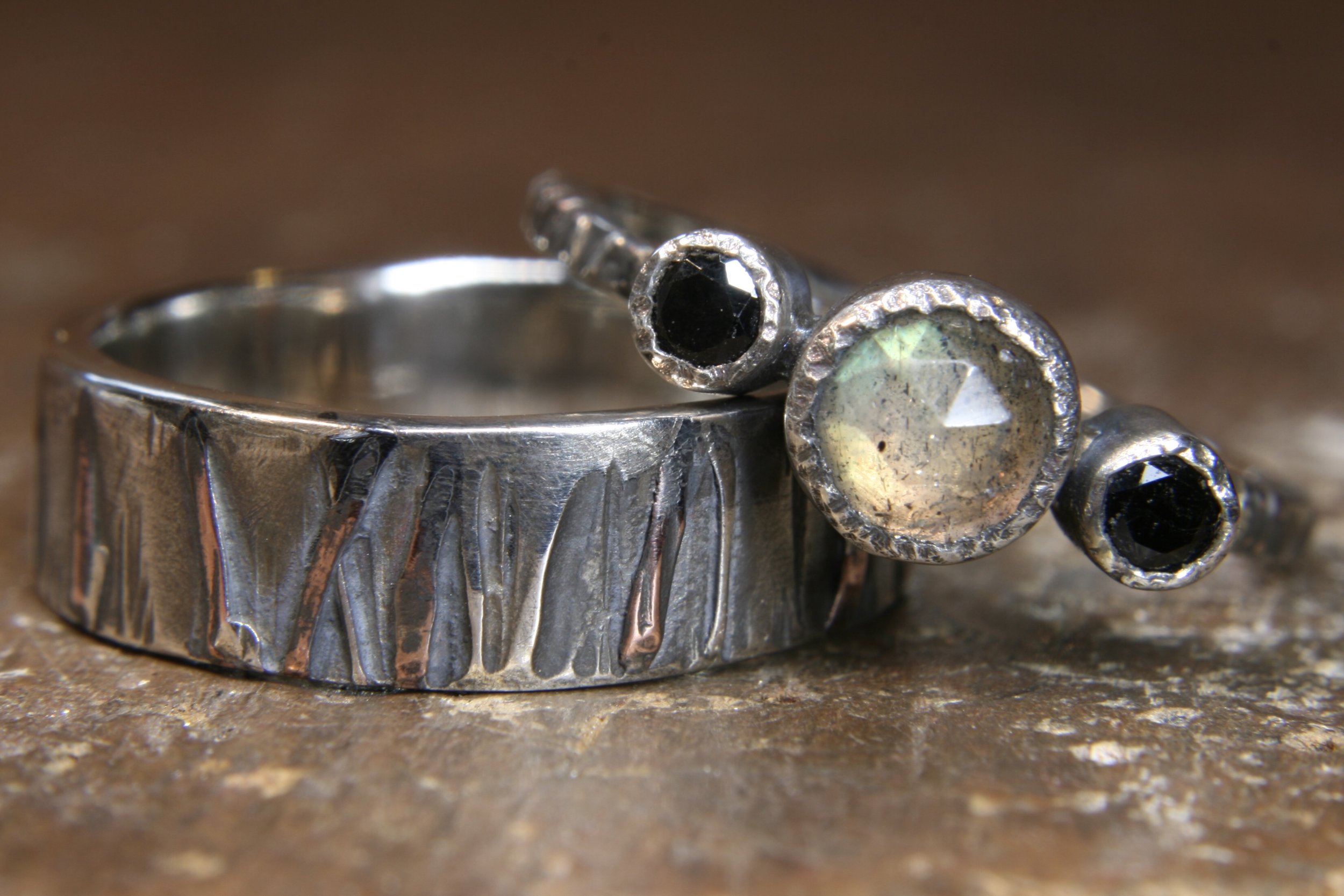 Eco-gothic rings set with black spinel and labradorite