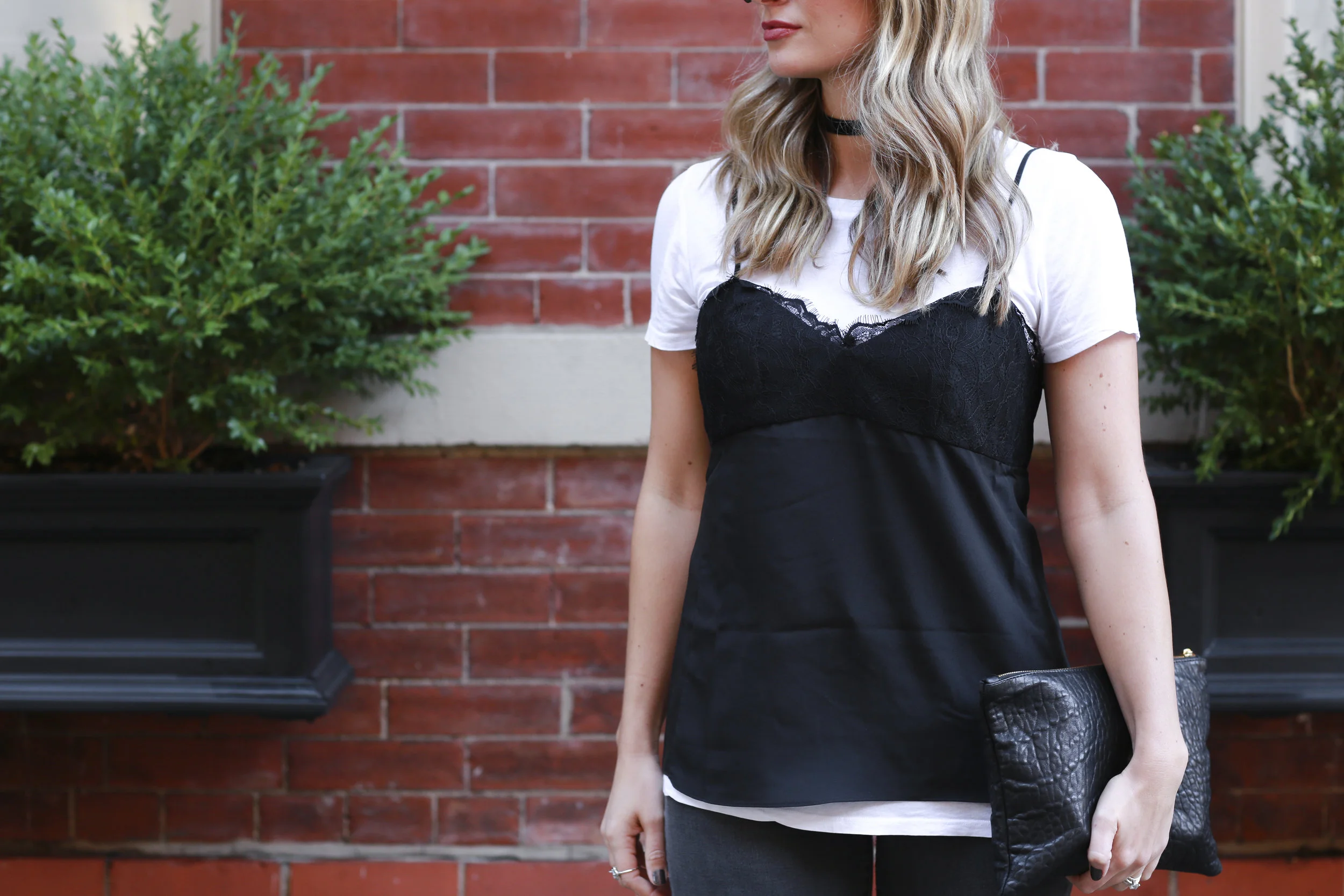 black lace camisole over a white t-shirt