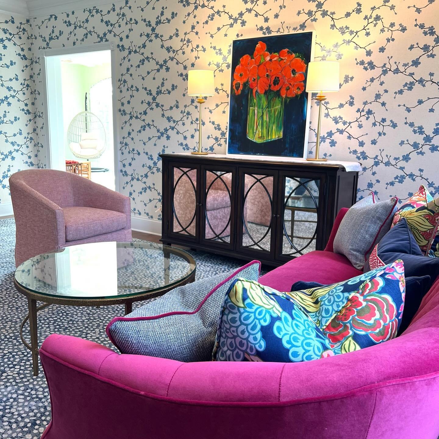 A bright &amp; beautiful room install just in time for the holidays. We LOVE the magenta velvet sofa paired with cute colorful swivels by @wesleyhallfurniture. Area rug expertly created and installed by @albed_rug_co. Happy holidays indeed! #mainline
