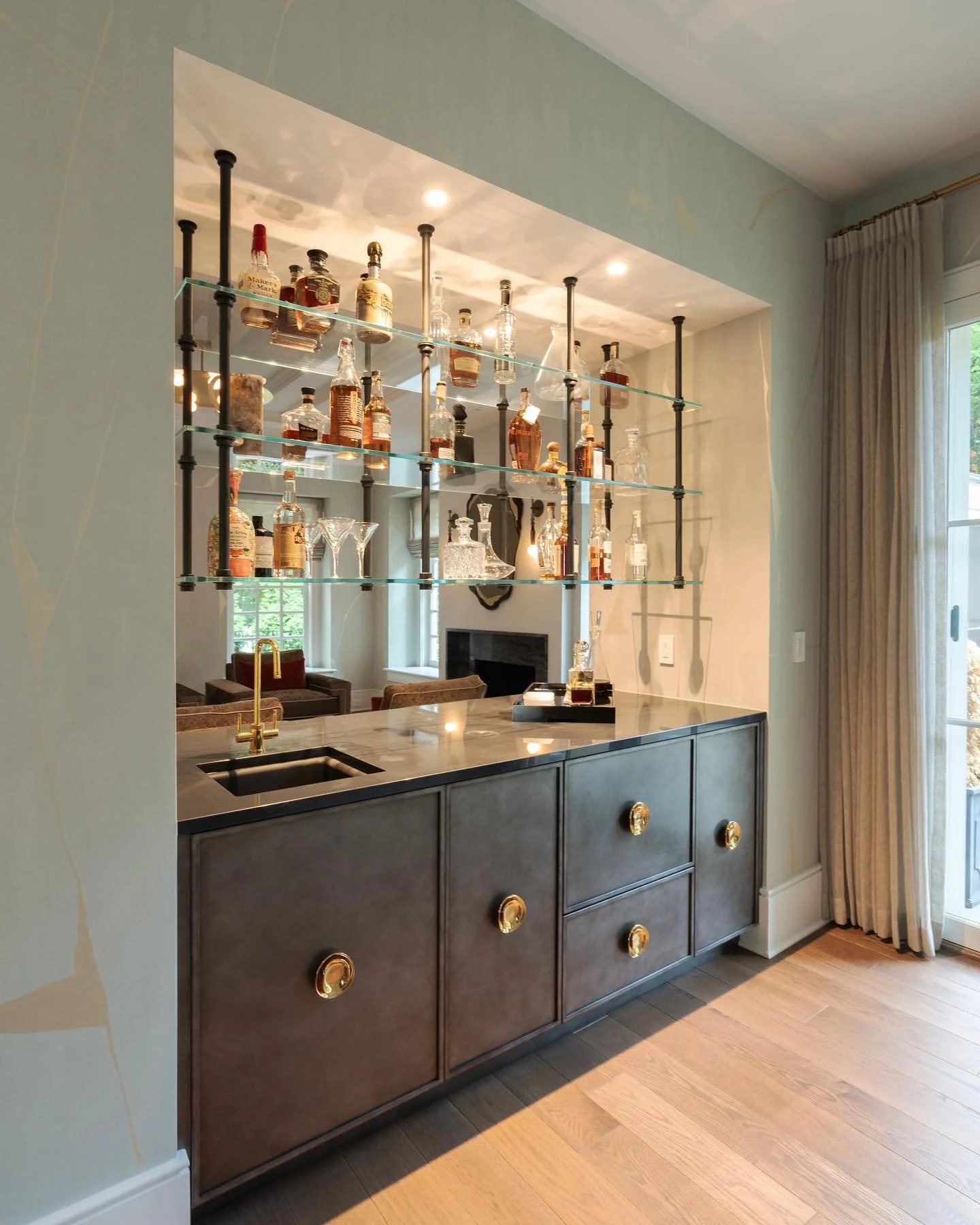 We love a chic double-sided bar for the client who entertains

Architecture &amp; Design: Abby Schwartz Associates
Contractor: Cappelletti Custom Builders
Interior Design: L. Kate Interiors 
Cabinetry: Bluebell Fine Cabinetry &amp; Design
Photographe