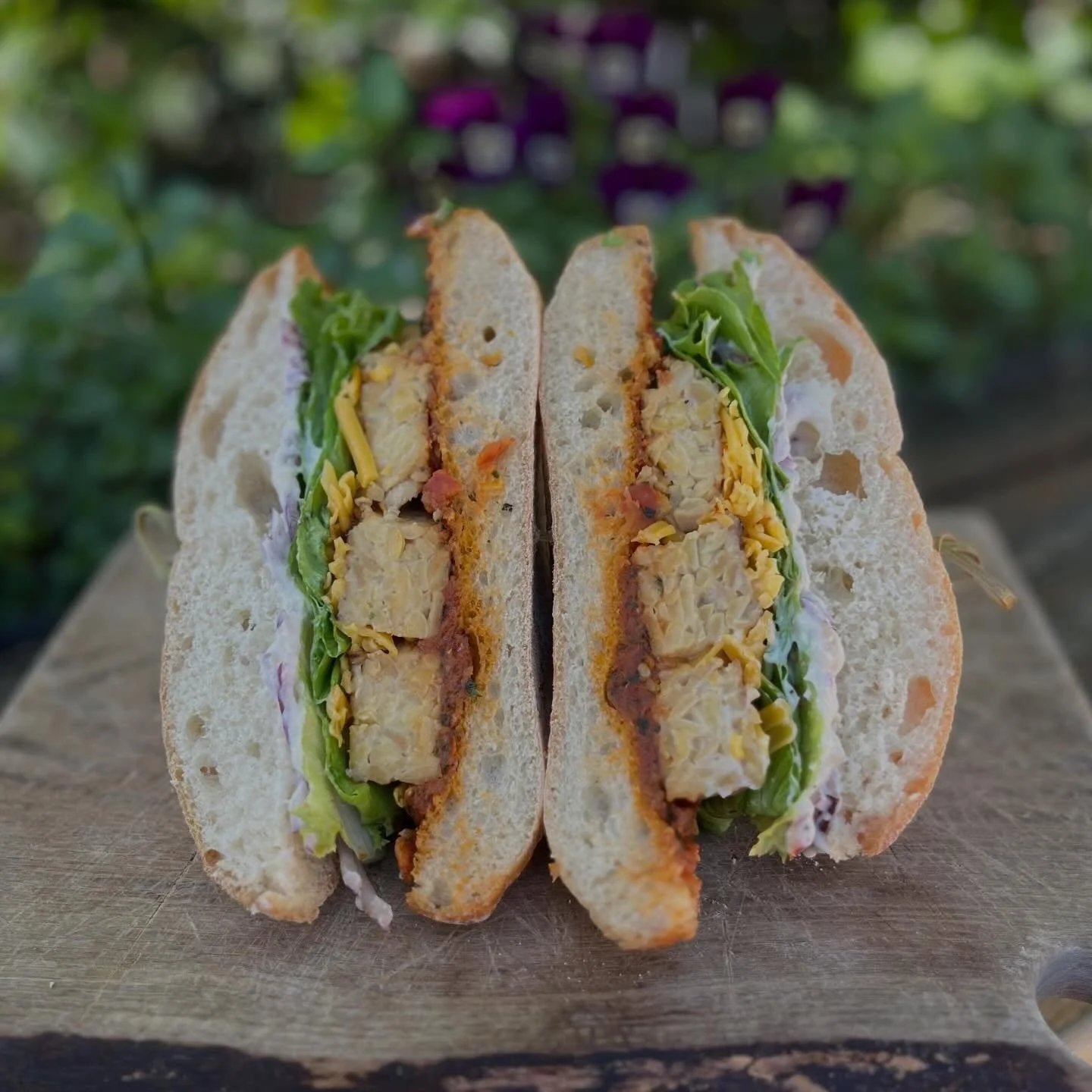 Today&rsquo;s Meatless Monday Special is &ldquo;Look Out Below!&rdquo; with tempeh, vegan cheddar, lettuce, red onion, sun-dried tomato relish, and roasted garlic veganaise in toasted ciabatta. 
The soups of the moment are Tomato and Leek or Chicken 