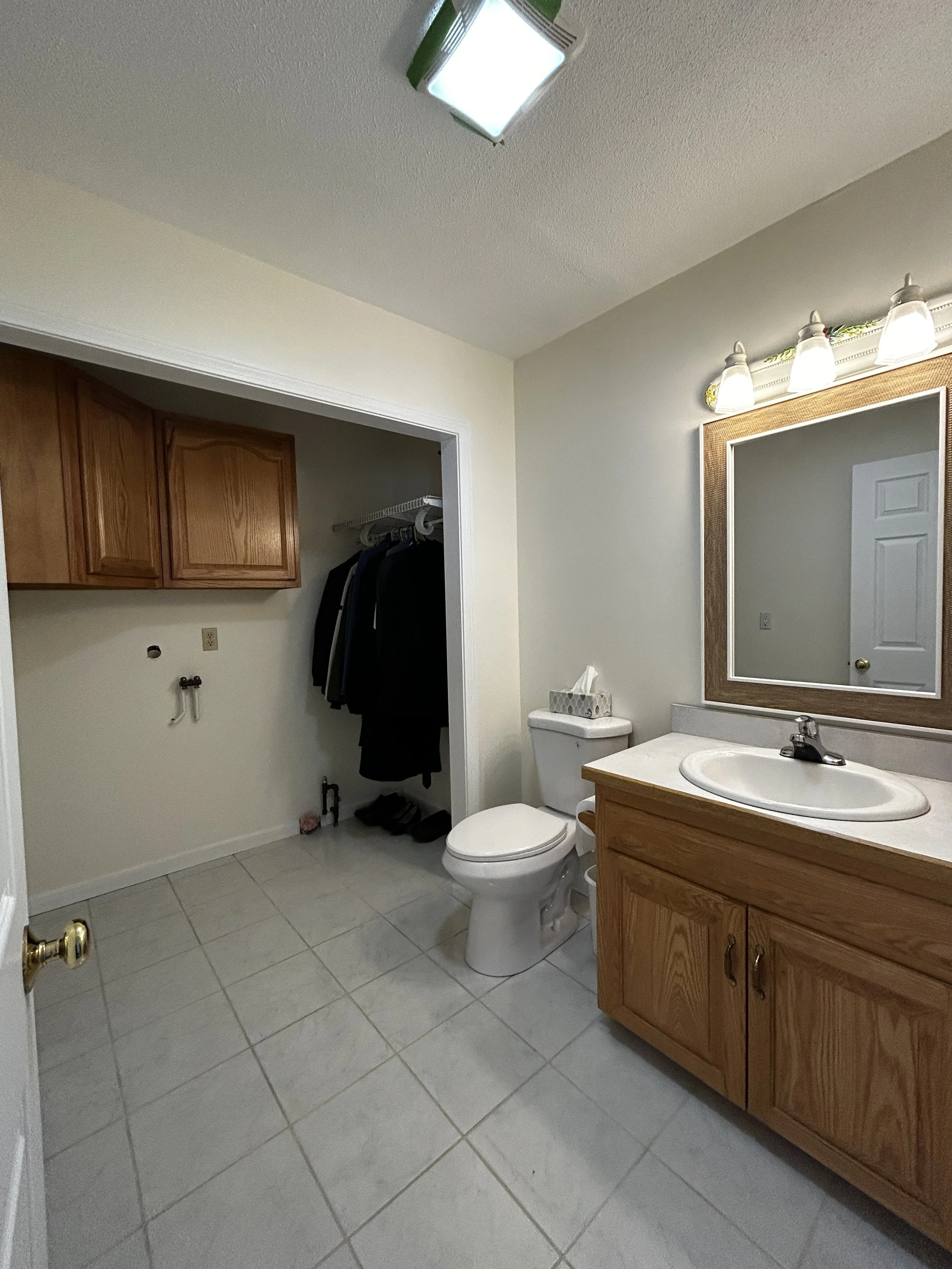 First floor half bathroom with washer and dryer hook up.