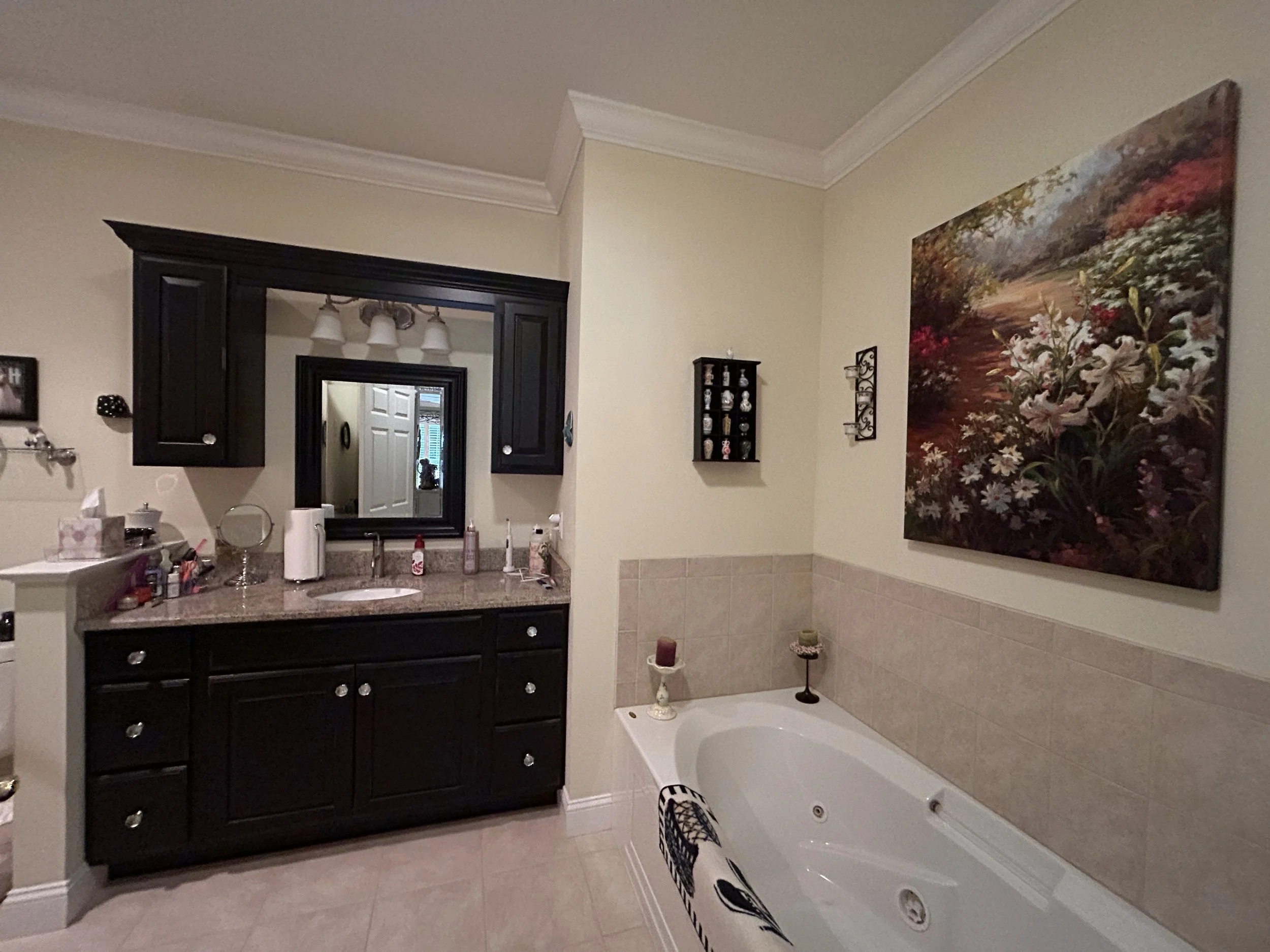 Full bathroom with jacuzzi tub and shower off of primary suite