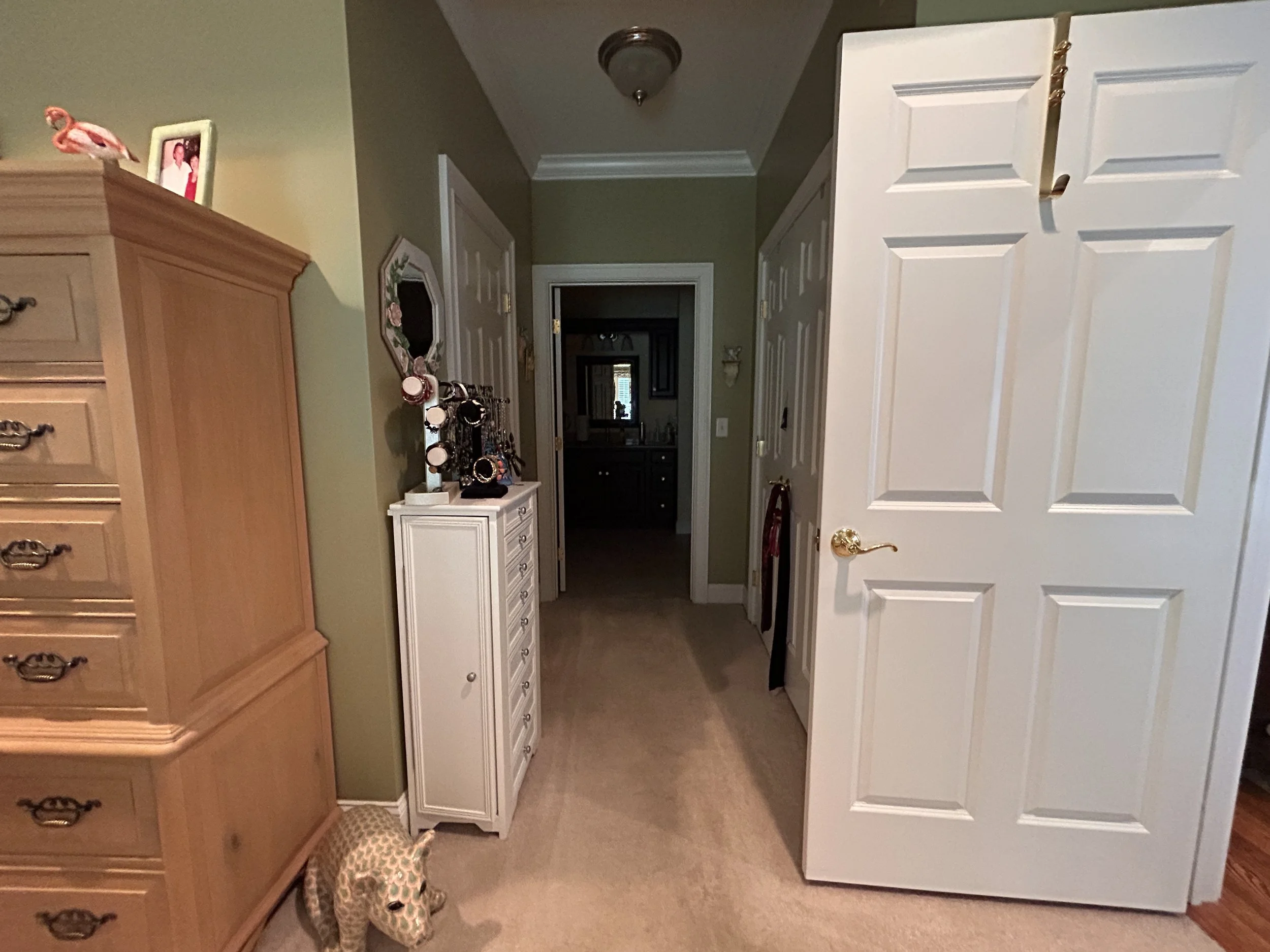 Hallway off of primary bedroom suite towards bathroom
