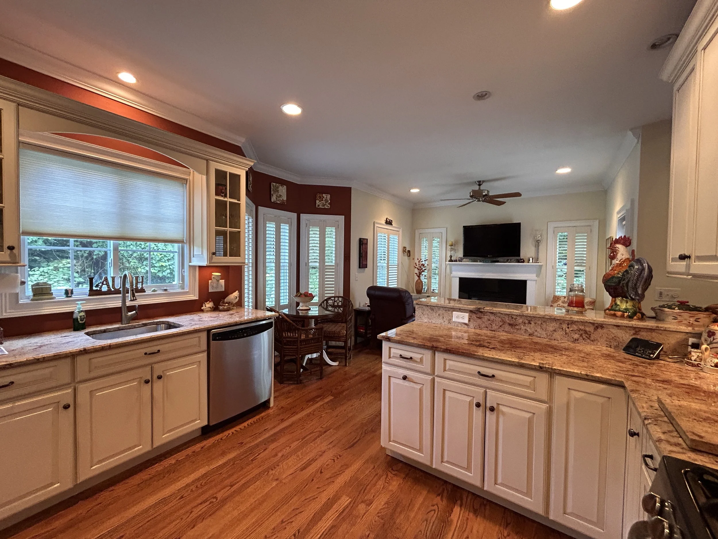 Kitchen looking towards bistro/sitting area with fireplace