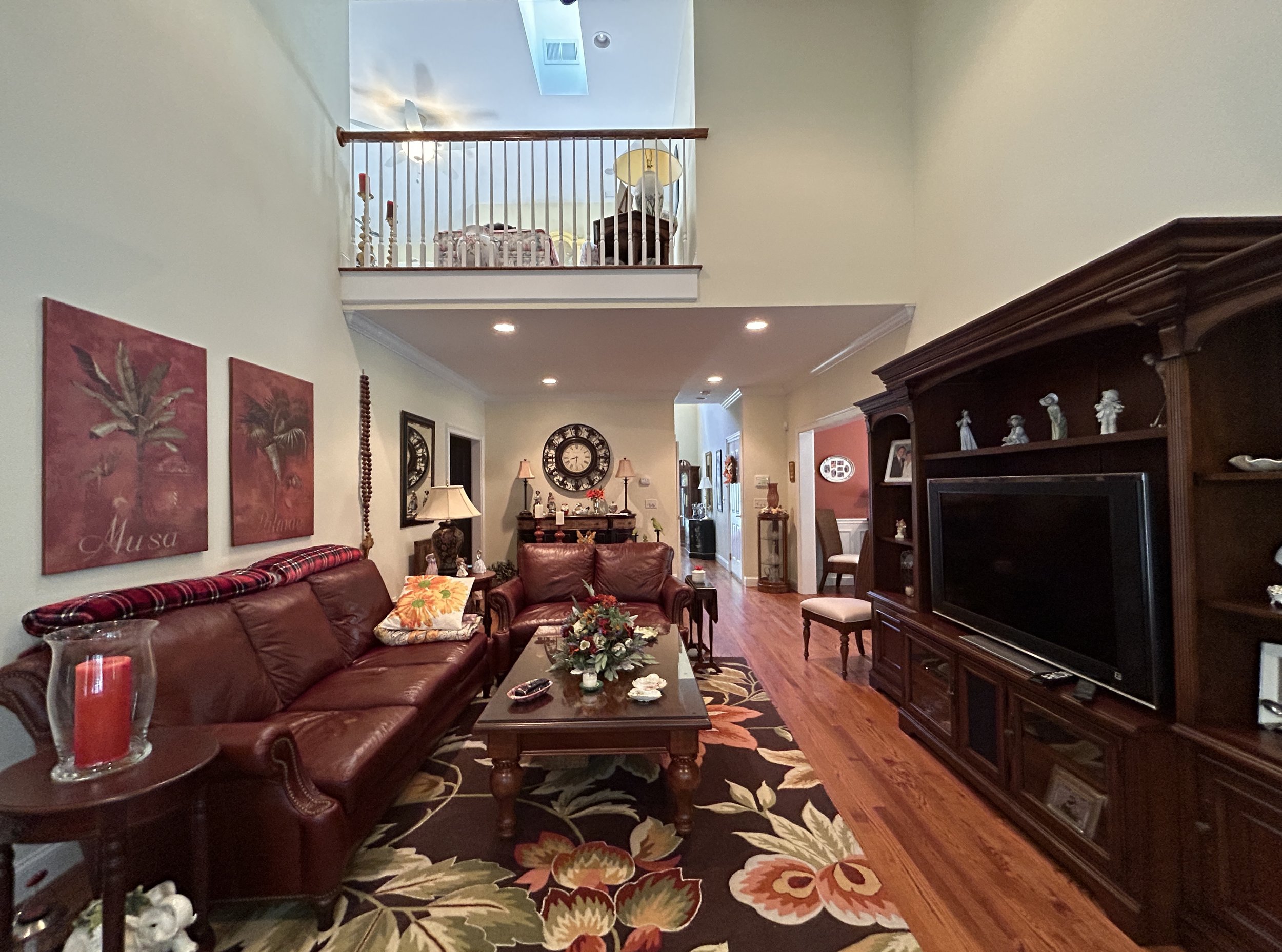 Living room looking towards upstairs den and balcony