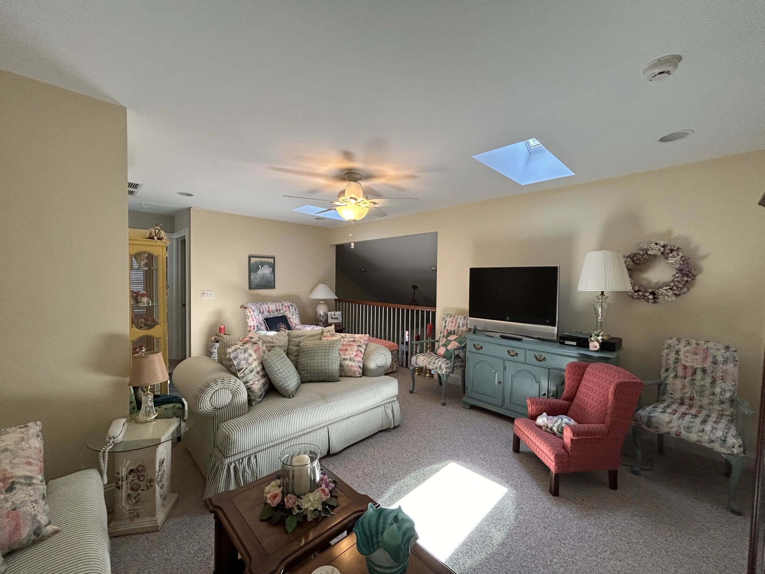 Upstairs den/office area with balcony overlooking living room