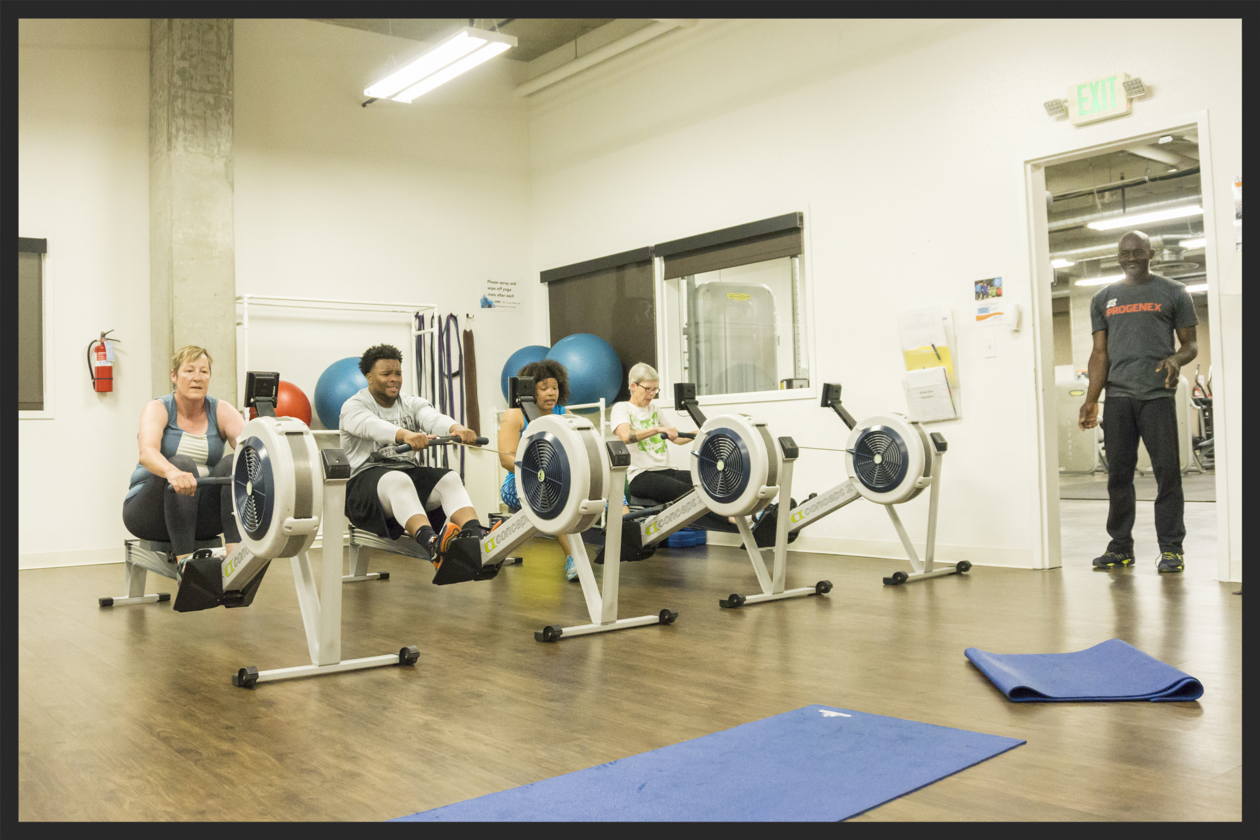 Che'lon and Daryl (center) rowing in Group Training