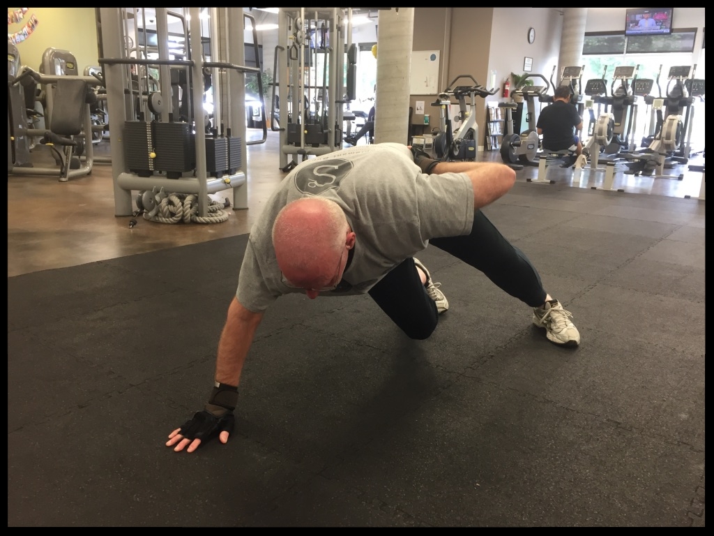 Leo demonstrates a one-handed push-up