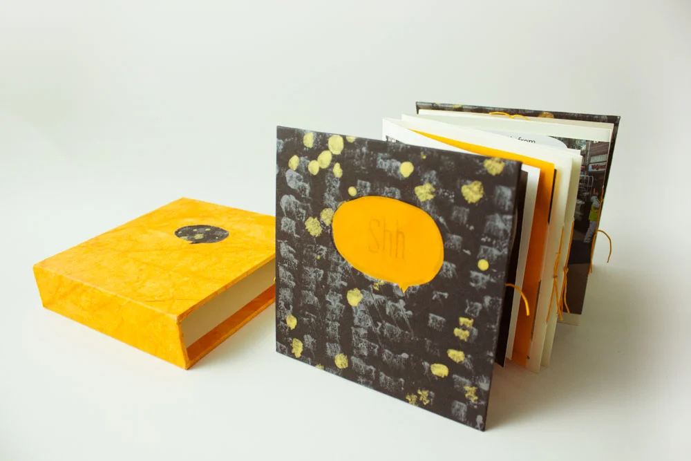 The paper color used were opposites. Black on yellow for the case, and yellow on black for the book cover with title.