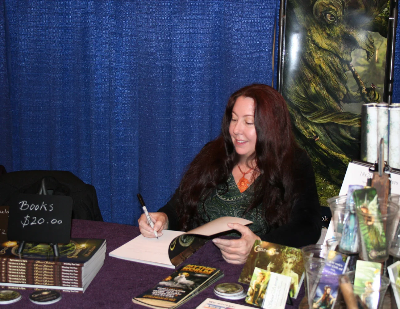 Me at the booth signing books
