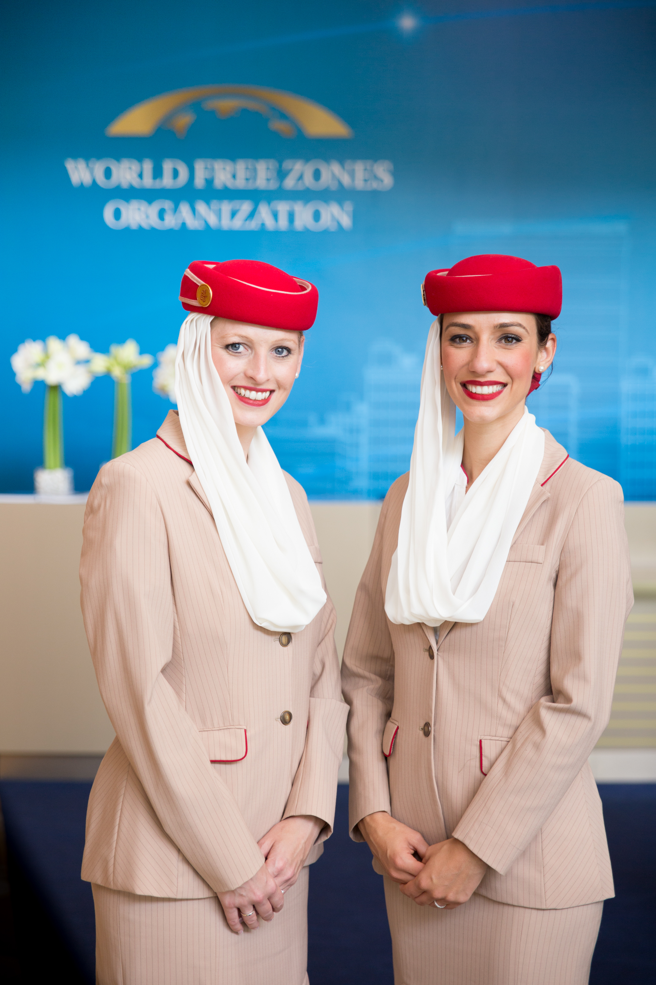 Coverage for World Free Zones organisation conference in Dubai. Two lovely Emirates Air hostesses pose for a photo.