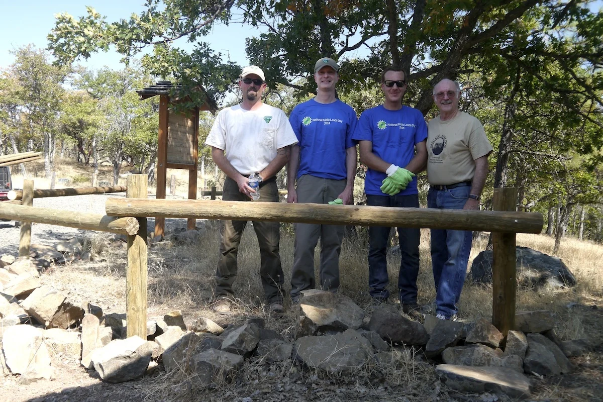 BLM Recreation Planner Zach Million (far left) leads effort to reconstruct rail fence in the Cascade-Siskiyou National Monument for National Public Lands Day. 