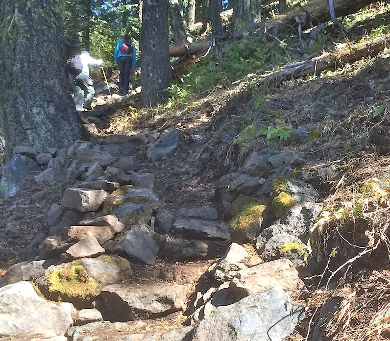 Hikers walk up Stone steps on Pilot Rock Trail. WWC 2014 Photo