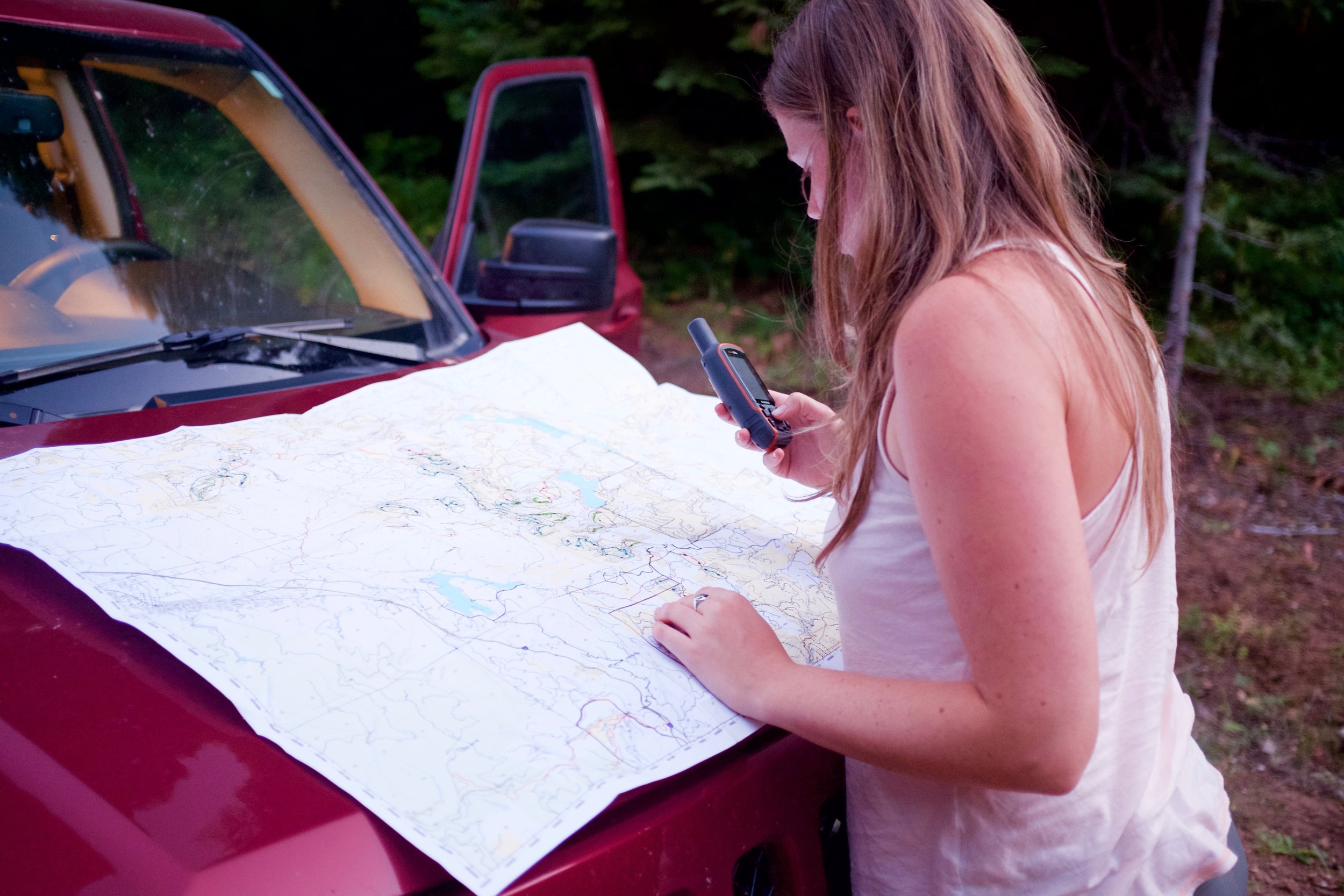  Emily Burke uses a BLM map and a GPS to navigate to the night’s first owl calling station on Soda Mountain Road near Hobart Bluff. &nbsp; 