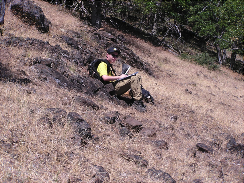  Kieran McCann plots location on map using a GPS unit. Photo by Jad D’Allura 