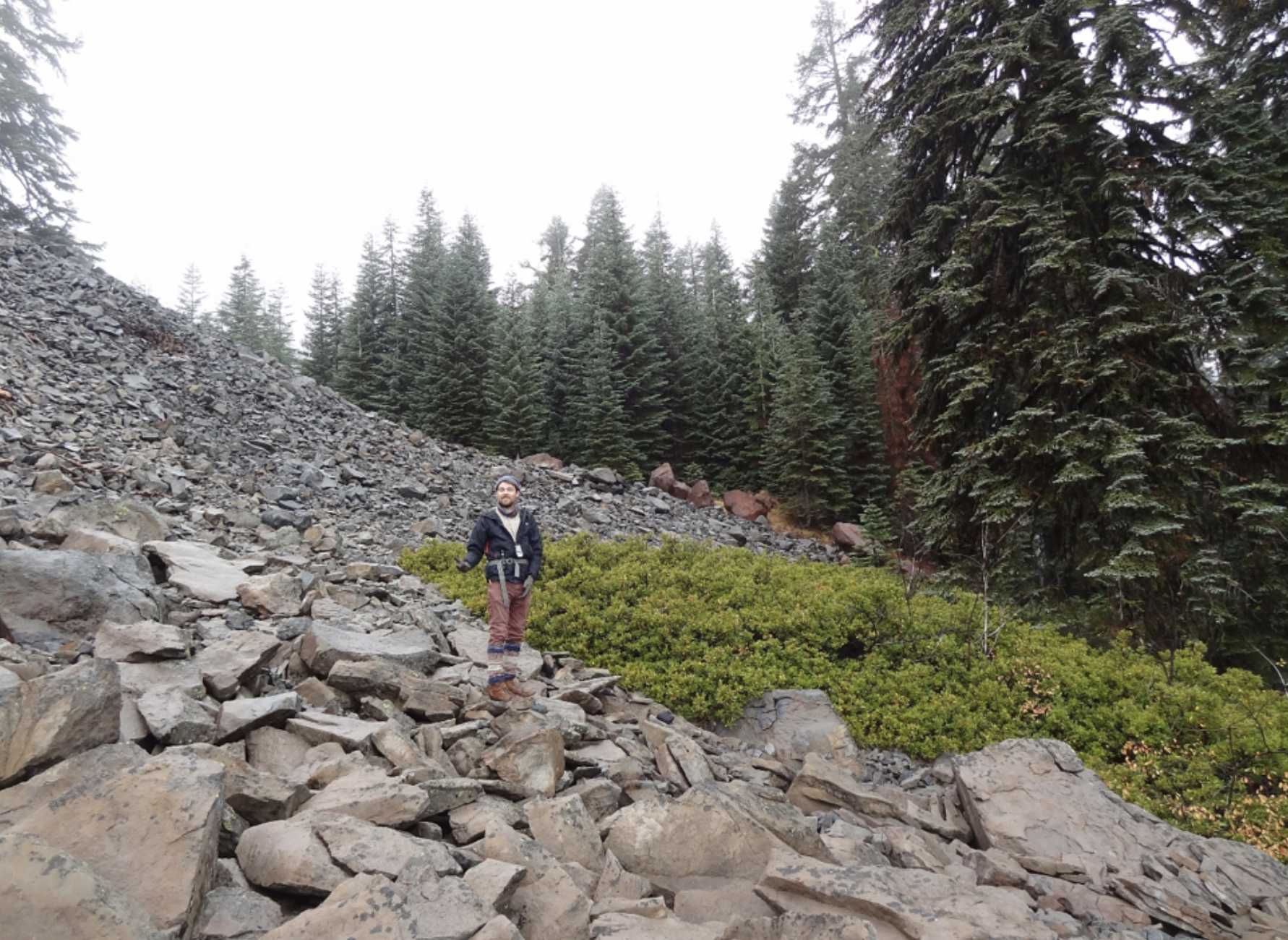 Neil Clayton, researching American pika, taking data along Surveyor Ridge.
