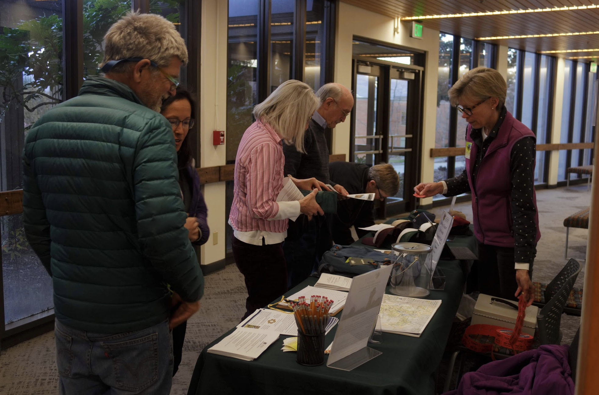  Community members interact at the registration table. 