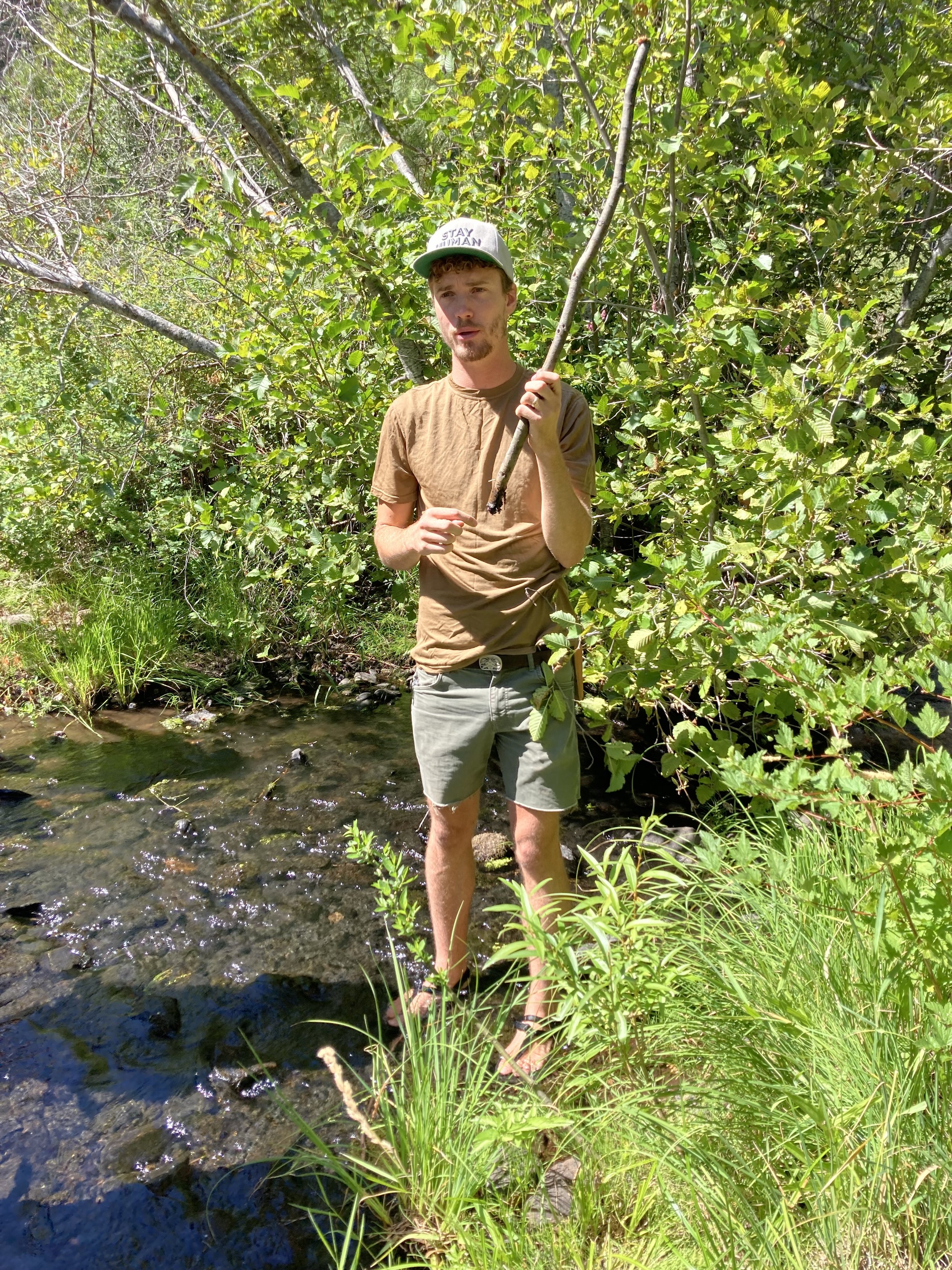  Demonstrating how to plant willow stakes. 