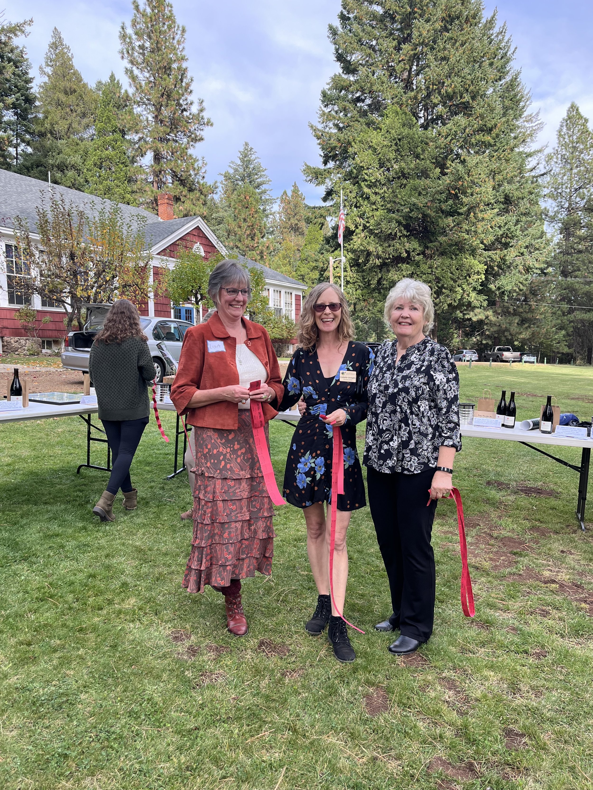   Lisa W., Collette and Cathy Streight with raffle tickets.  