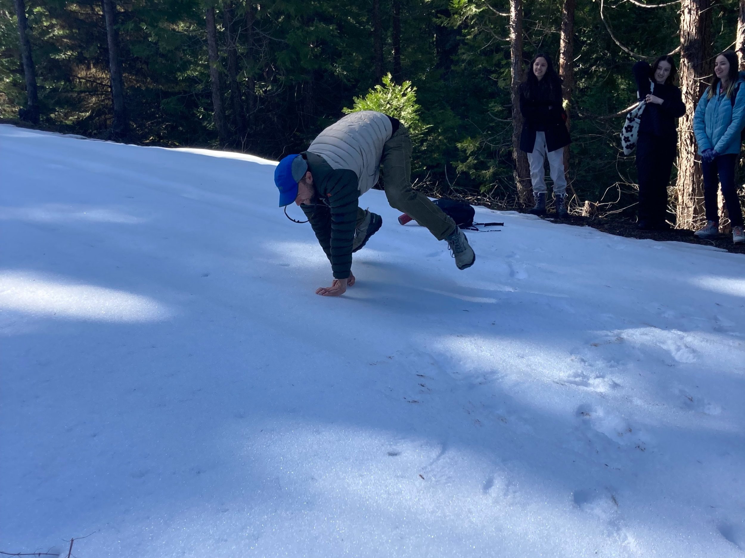 Nolan demonstrating the bound of a snowshoe hare