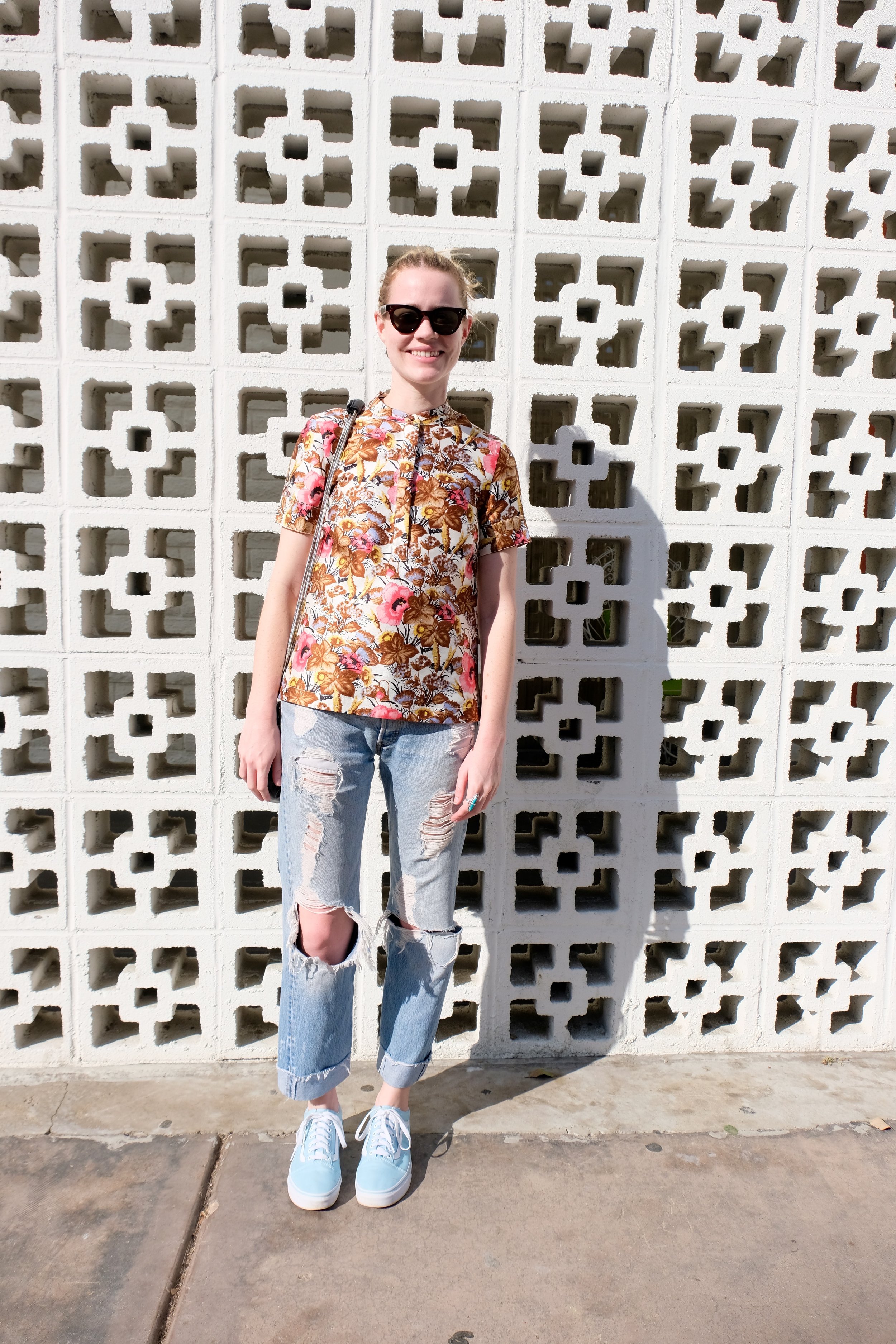 Celine wayfarer sunglasses, J.Crew Collection top, Re/Done vintage Levi's and Vans Old School sneakers in ice blue.