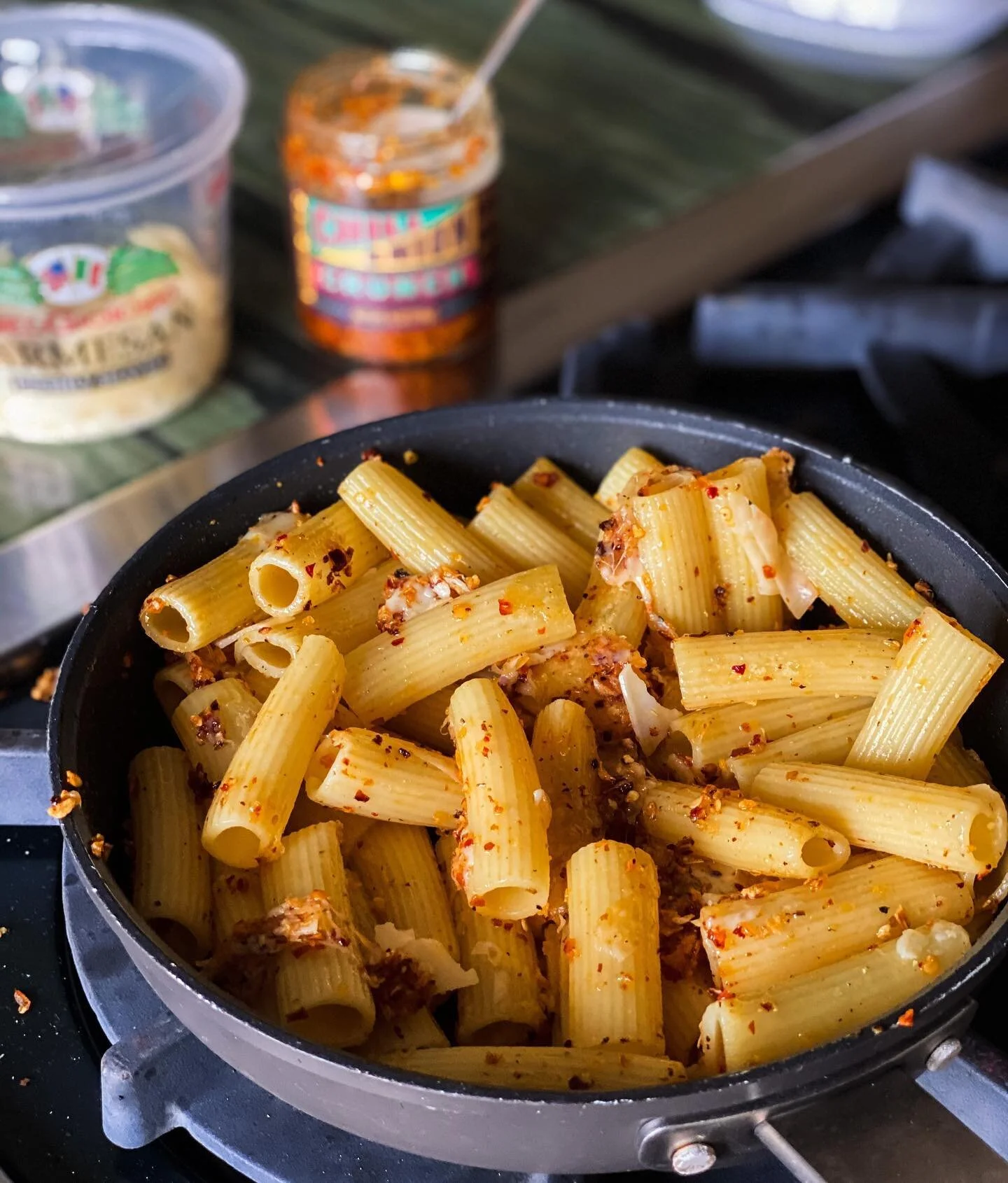 Haven&rsquo;t posted in a bit, but I fried up some leftover pasta with shaved Parmesan and @traderjoes chili onion crunch for lunch and it was so dang delicious I needed to share it here. Also shared some other ideas on how to use the crunchy goodnes