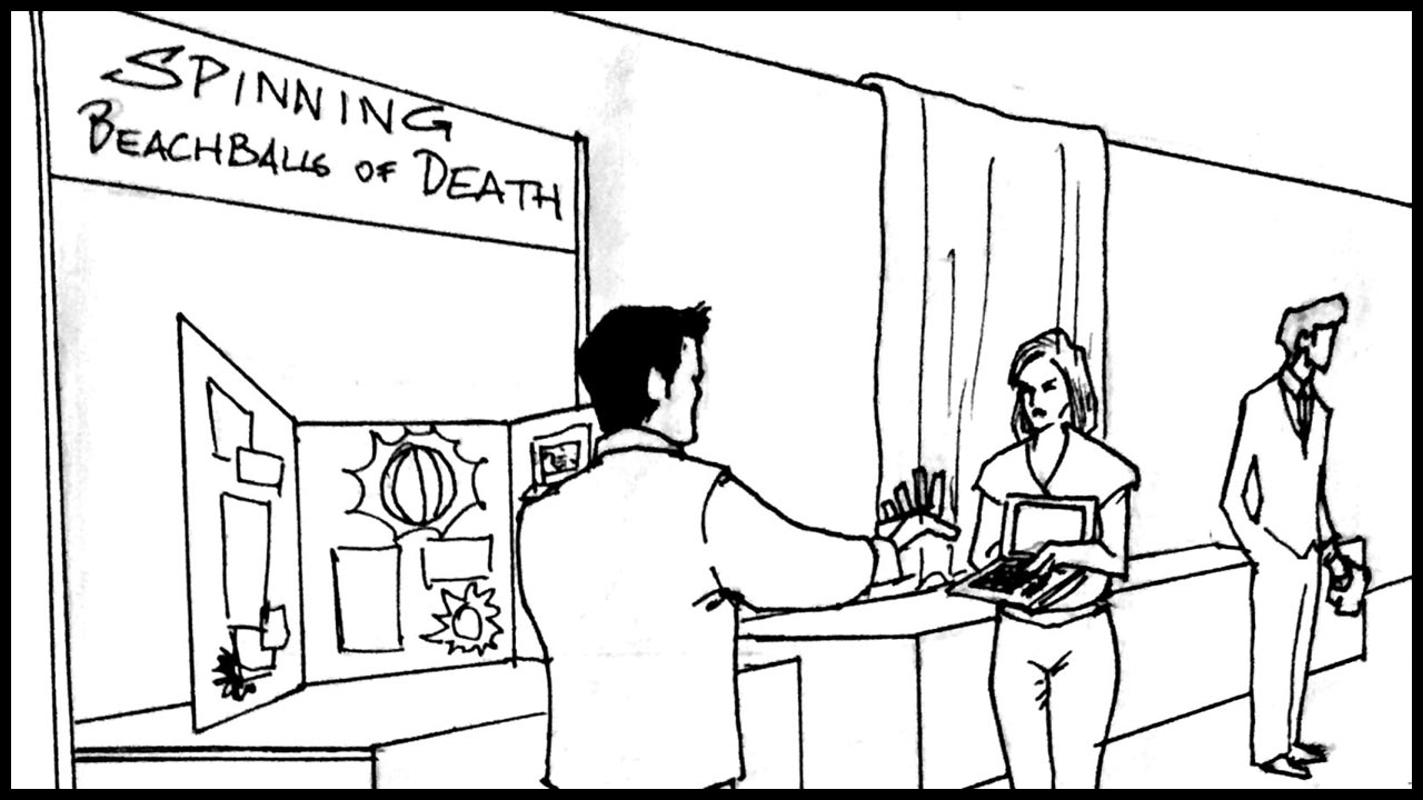    A lady holds up her computer in front of a booth labeled: “SPINNG BEACHBALLS OF DEATH”       Lady:  "See?? Days now. I can’t do anything!"    