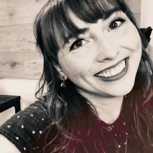 A series of portraits of Nicole Lange displaying in quick succession showing casual and images of her smiling.