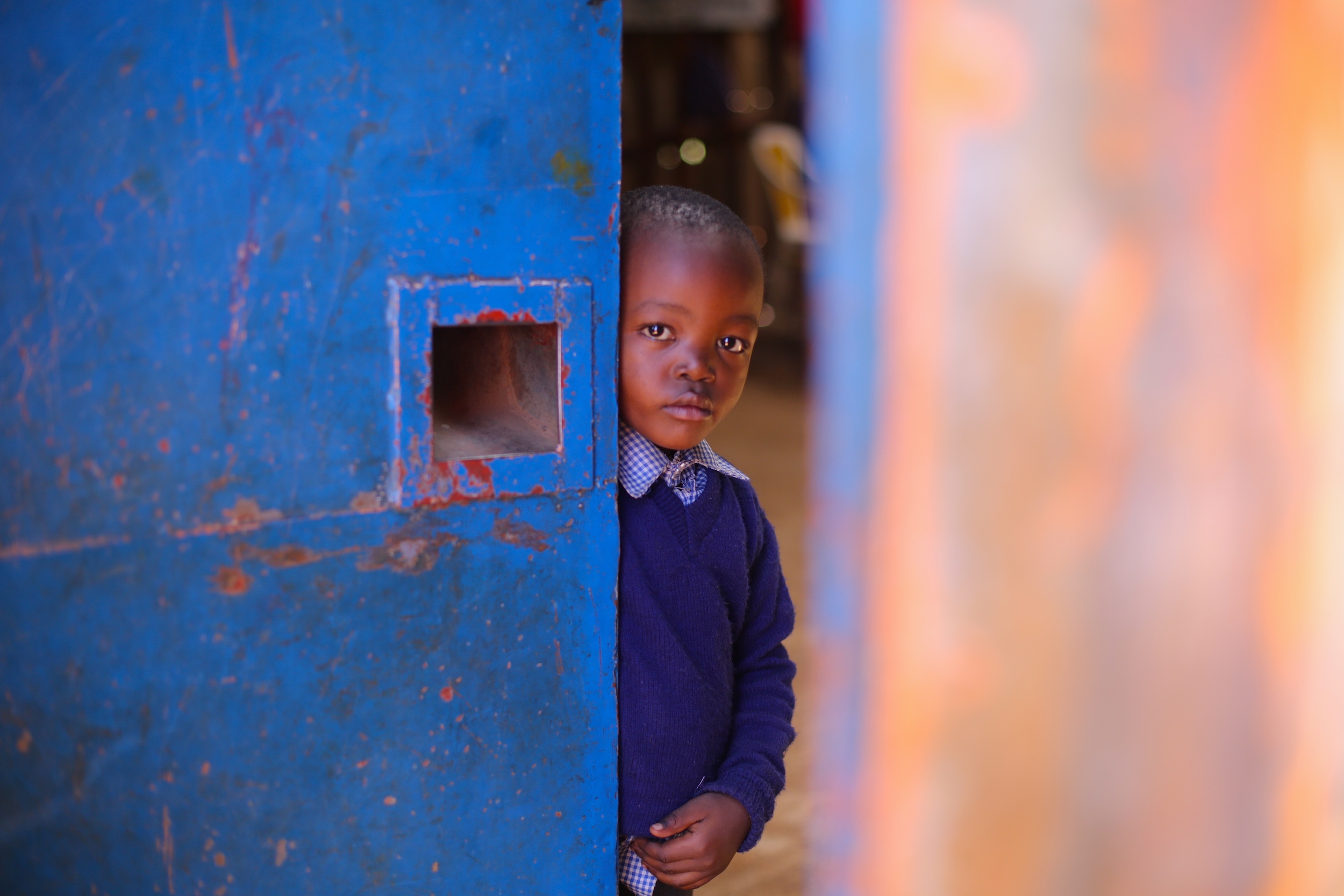 A student in Kibera takes a break from studying