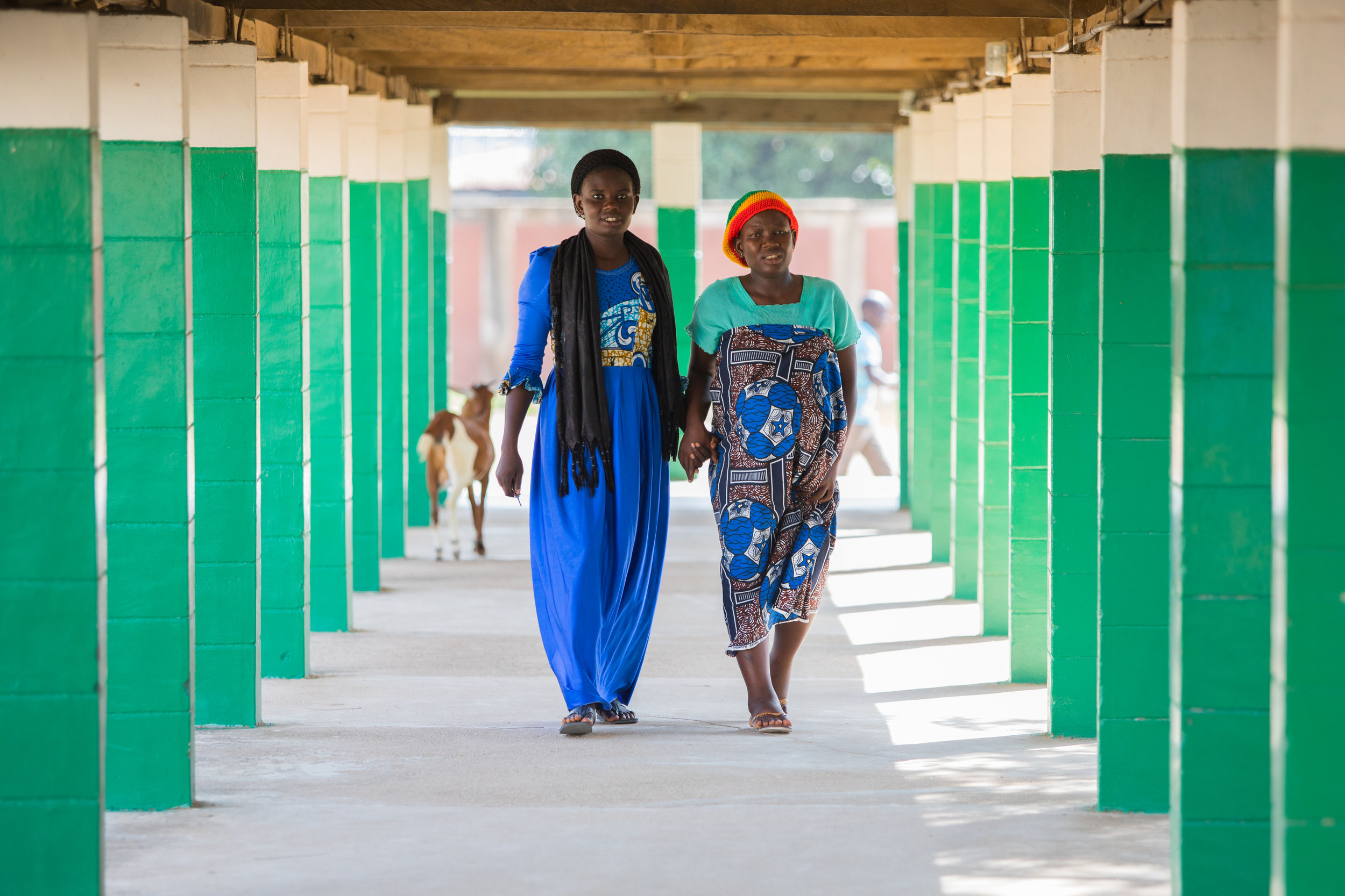 A woman helps her pregnant friend in a hospital in Adamawa state, Nigeria