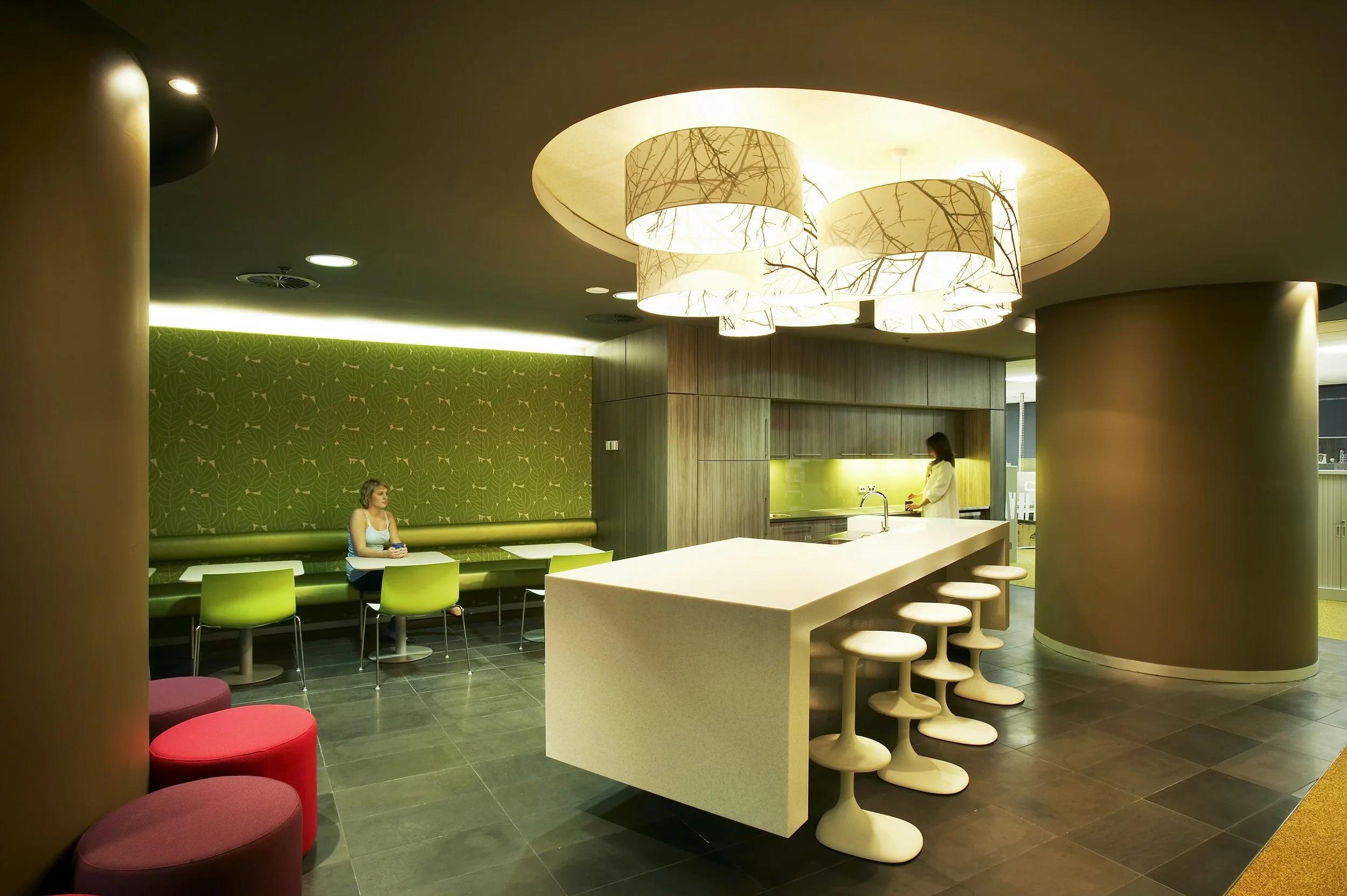Staff hub within a workplace interior featuring rich textures, colour and a space for gathering and connection