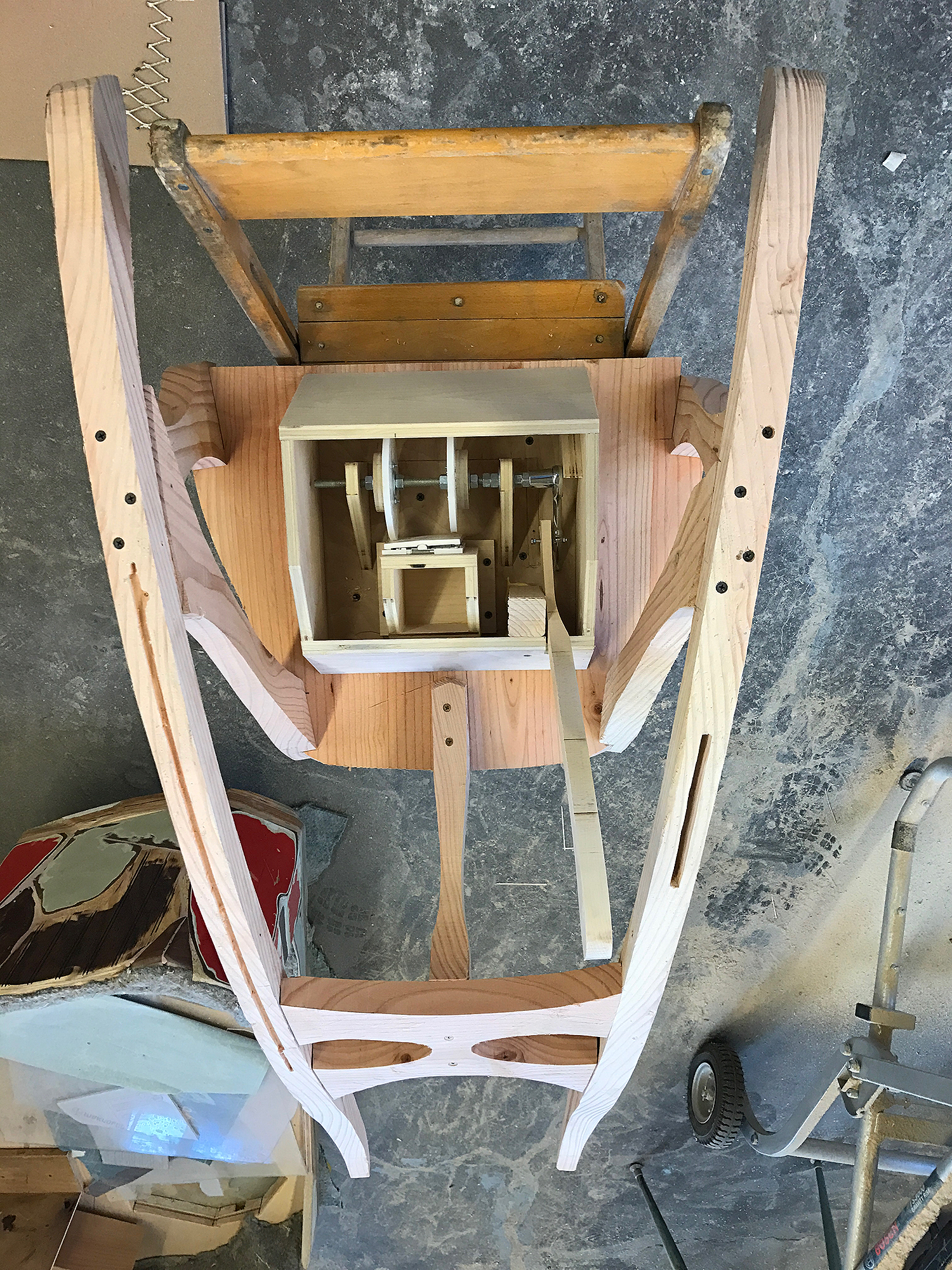 the mechanism attaches to the underside of the rocker seat