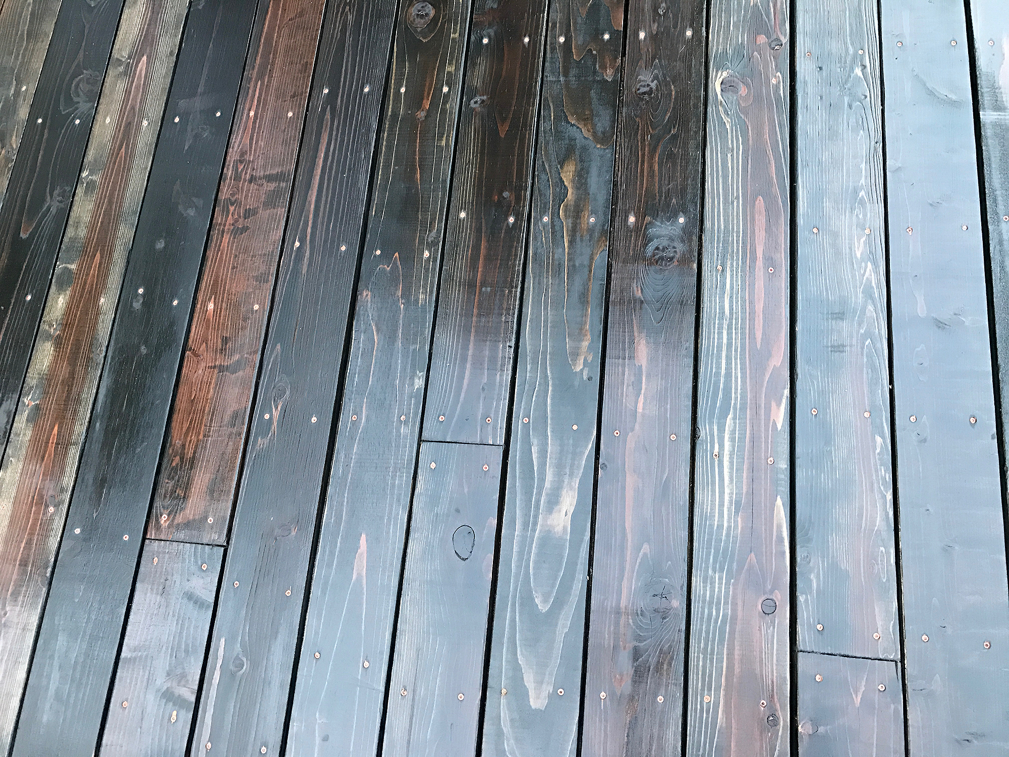 the redwood colors under the stain lend a nice warmth to the deck