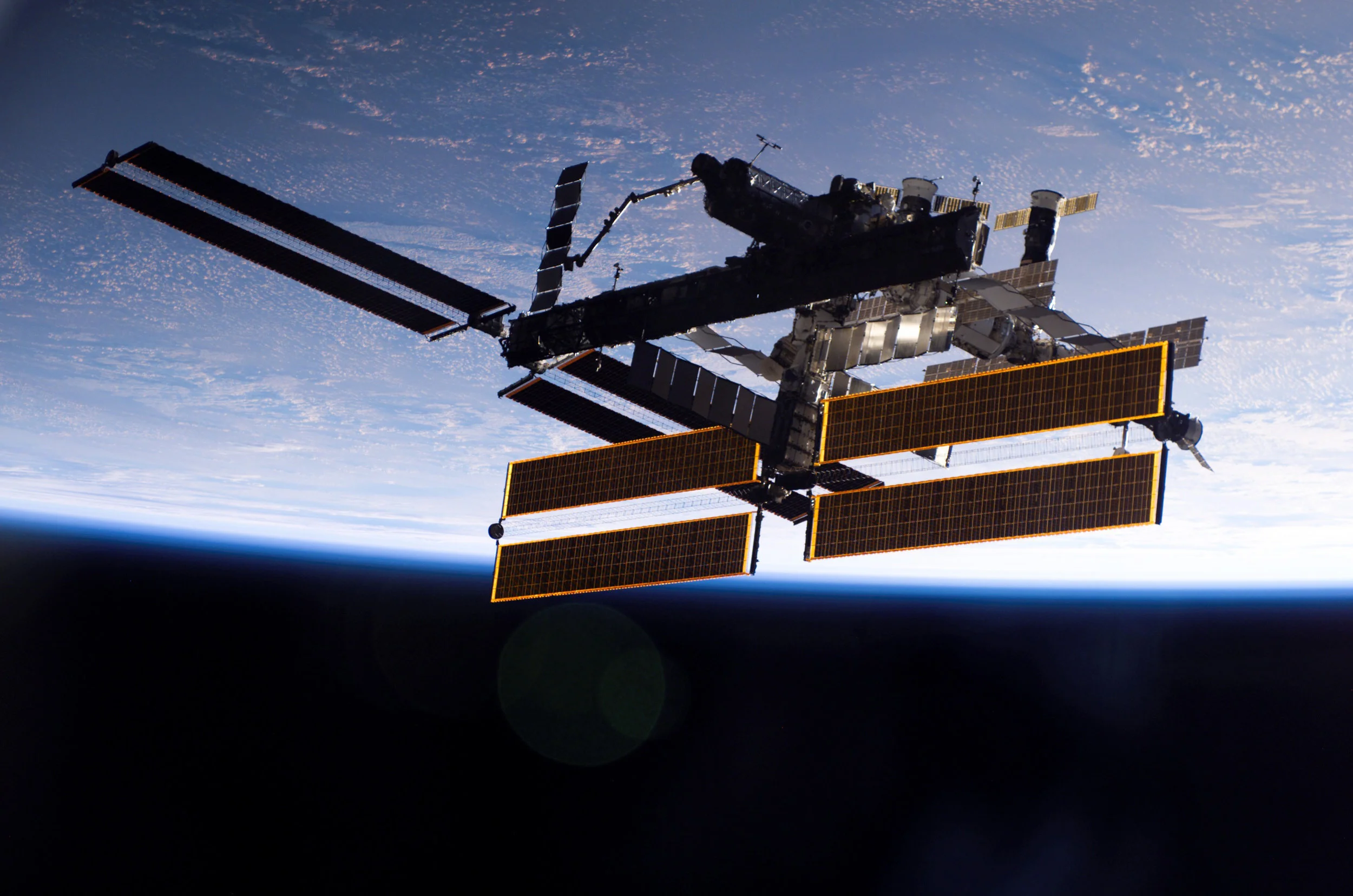 The International Space Station against the backdrop of Earth in 2006 (Courtesy of NASA )