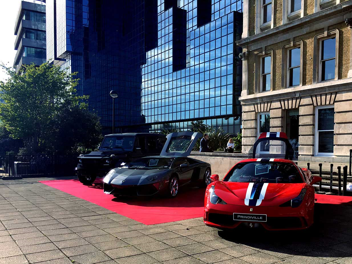 Prestige cars welcoming visitors to the London Yacht, Jet and Prestige Car Show