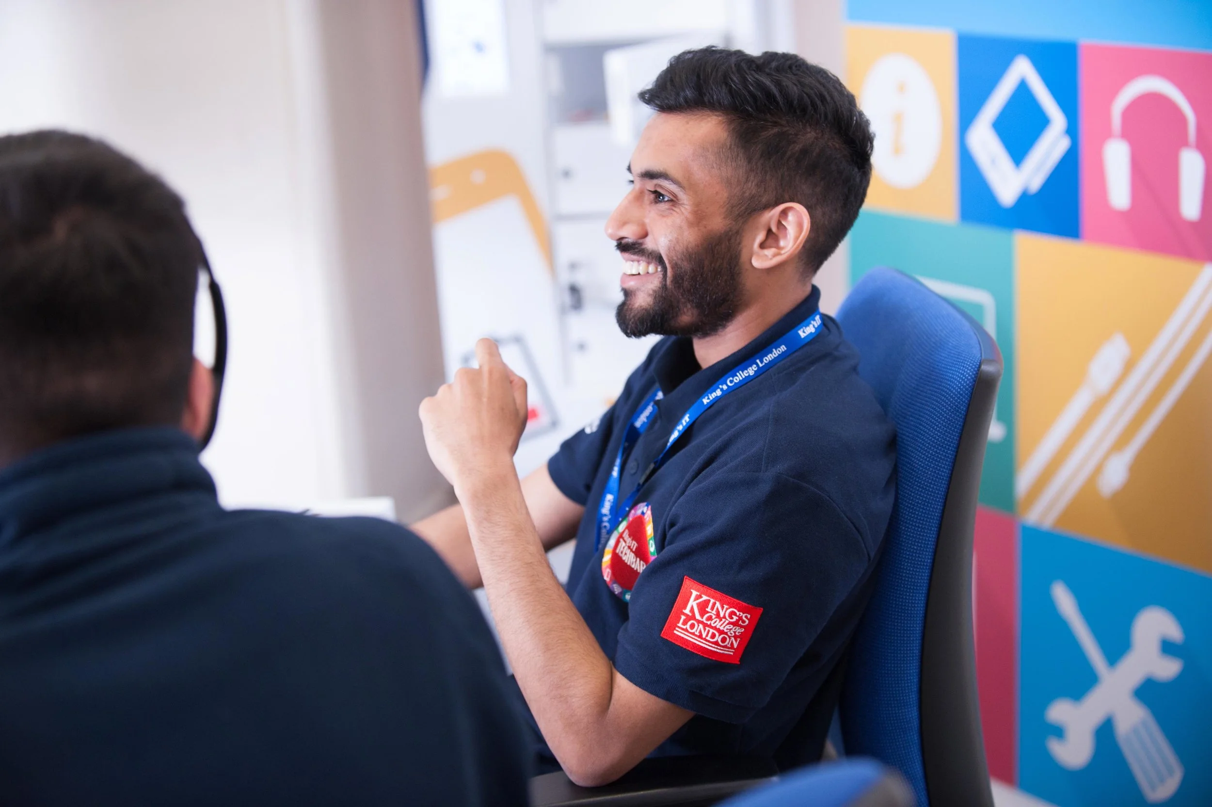 Marketing portrait of man laughing at Kings College London